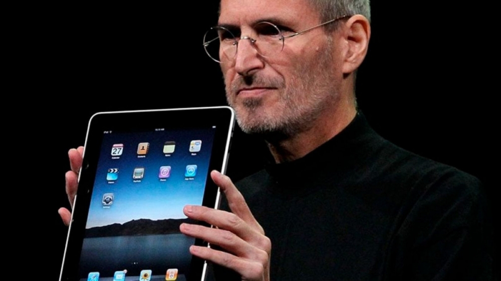 Steve Jobs holding the original iPad in 2010.