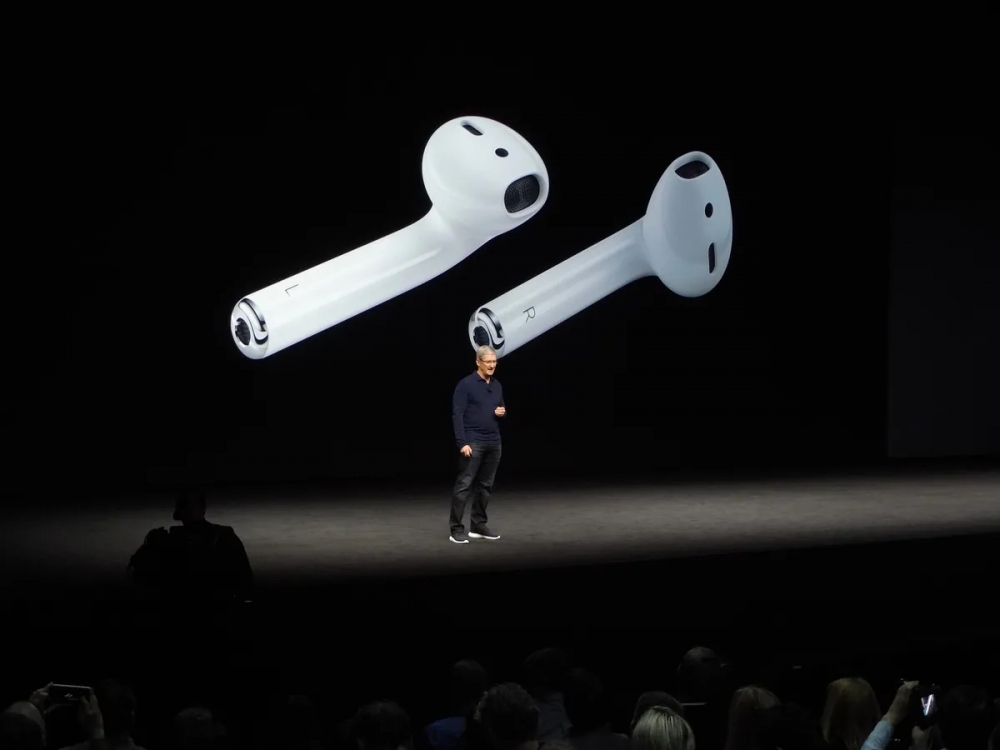 Tim Cook announces Apple AirPods onstage at an Apple Event in 2016. This Apple Event also saw the announcement of the iPhone 7 which was the first iPhone to debut without a 3.5mm headphone jack.