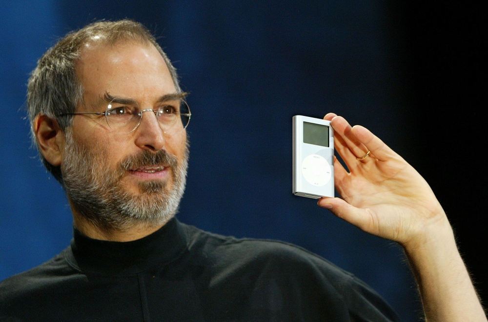 Steve Jobs holding the original iPod
