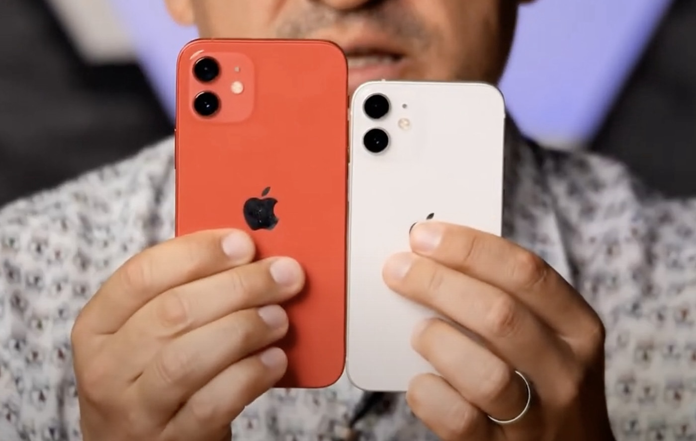 The iPhone 12 (left) and iPhone 12 mini (right) being held in someones hand.