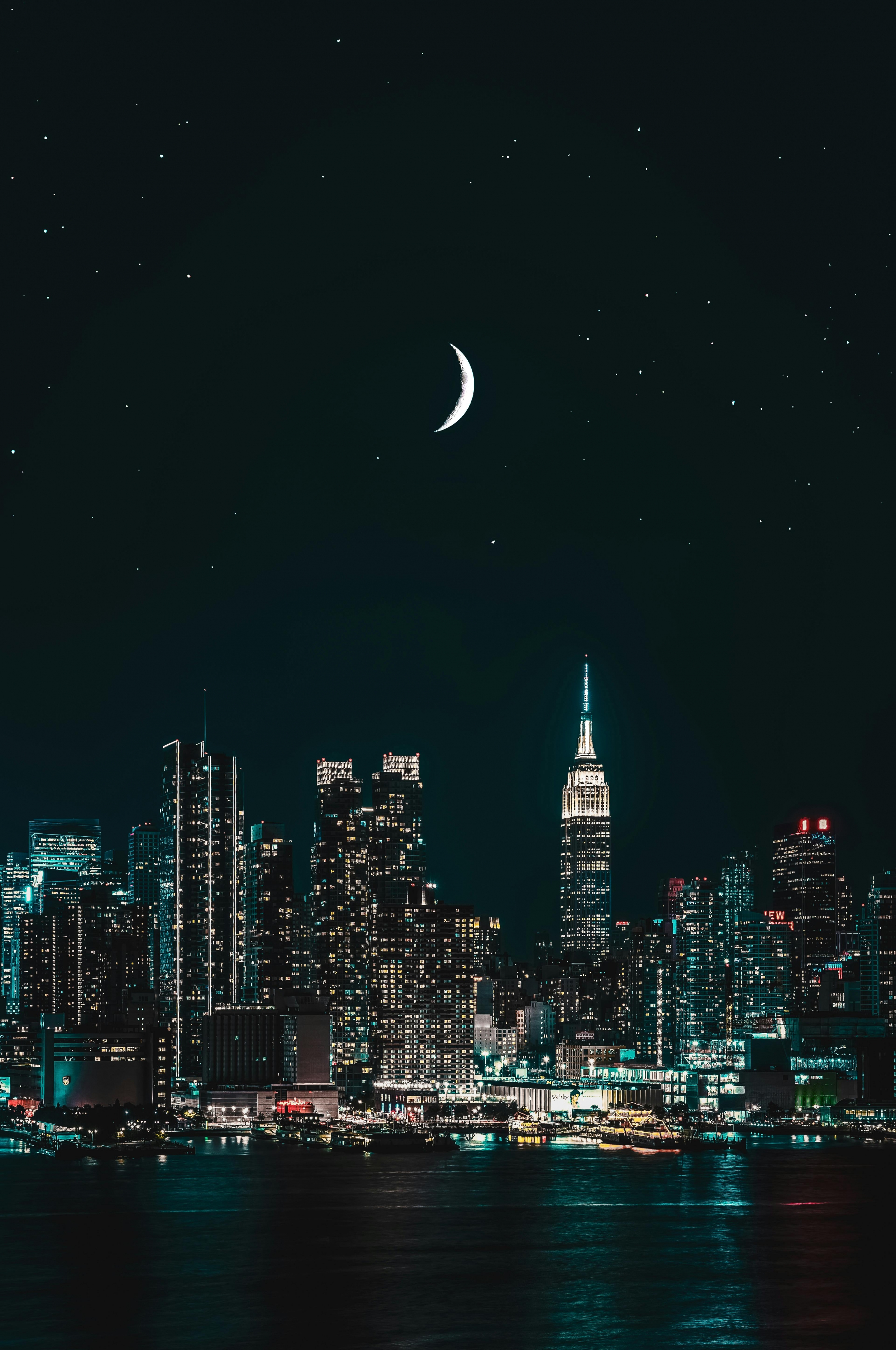 City Buildings At Night With Crescent Moon Stars wallpaper for Apple iPhone, Apple Watch, Mac, iPad and Apple Watch