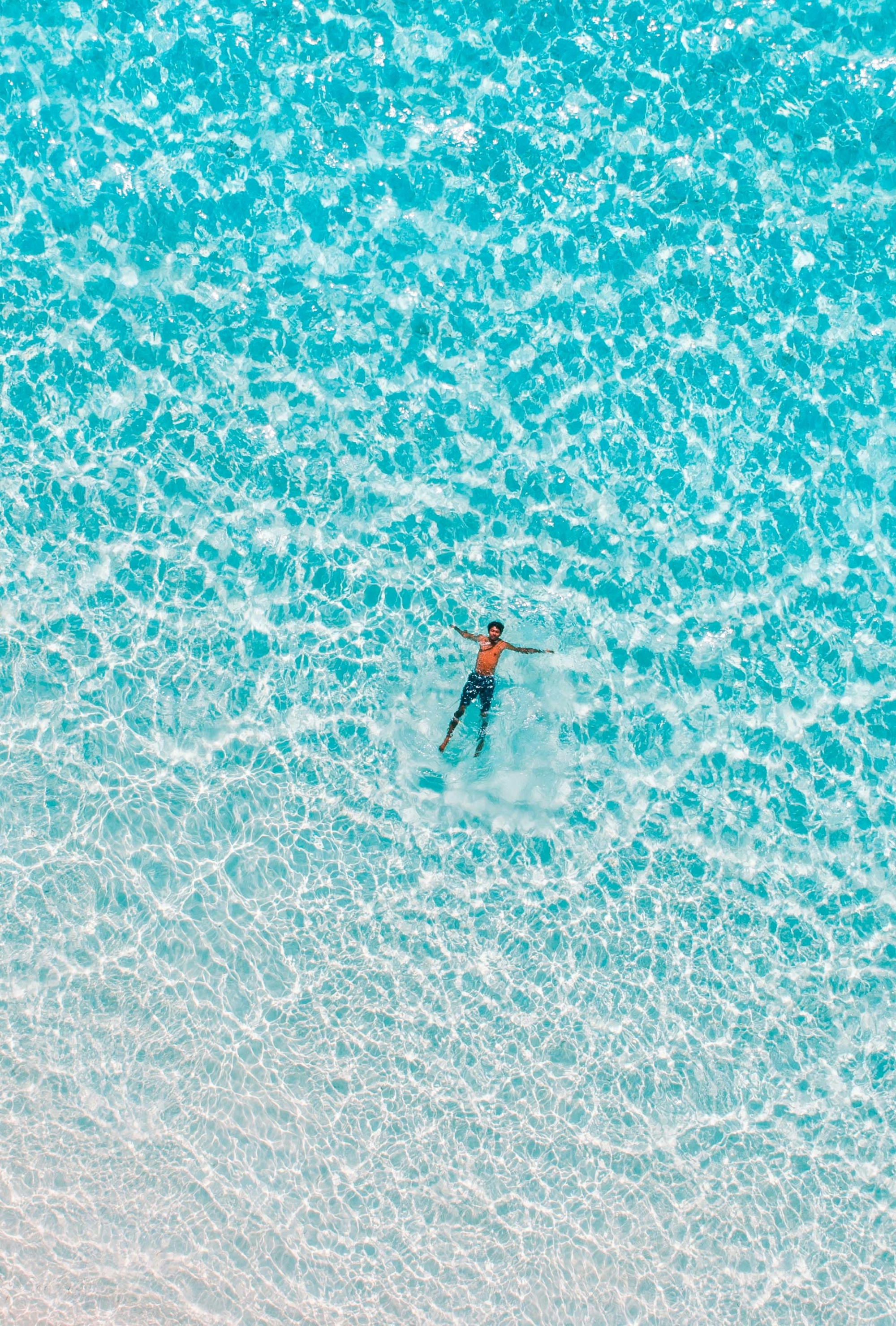 Clear Blue Water From Above wallpaper for Apple iPhone, Apple Watch, Mac, iPad and Apple Watch