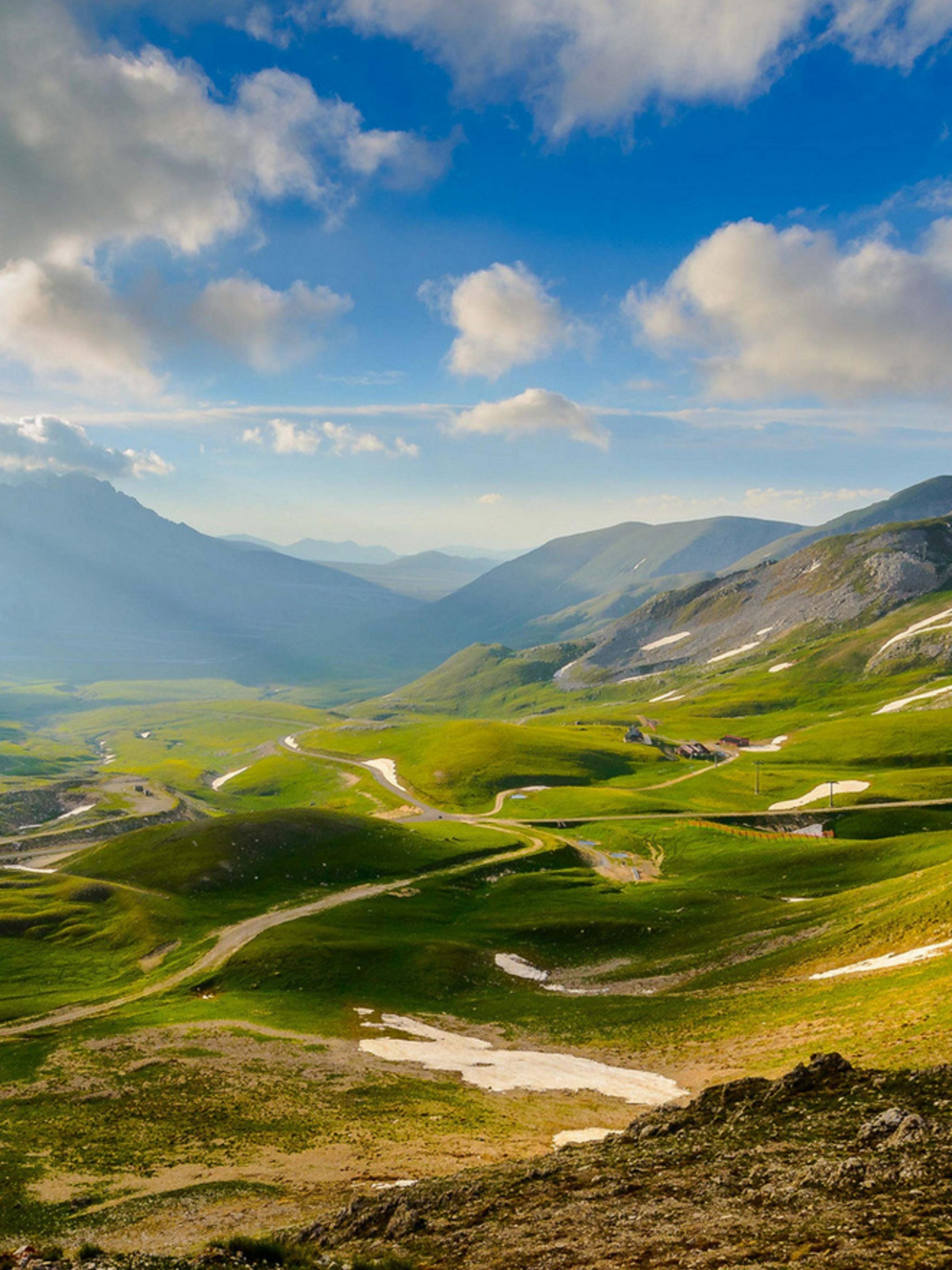 Gorgeous Green Landscape With Mountains And Clouds