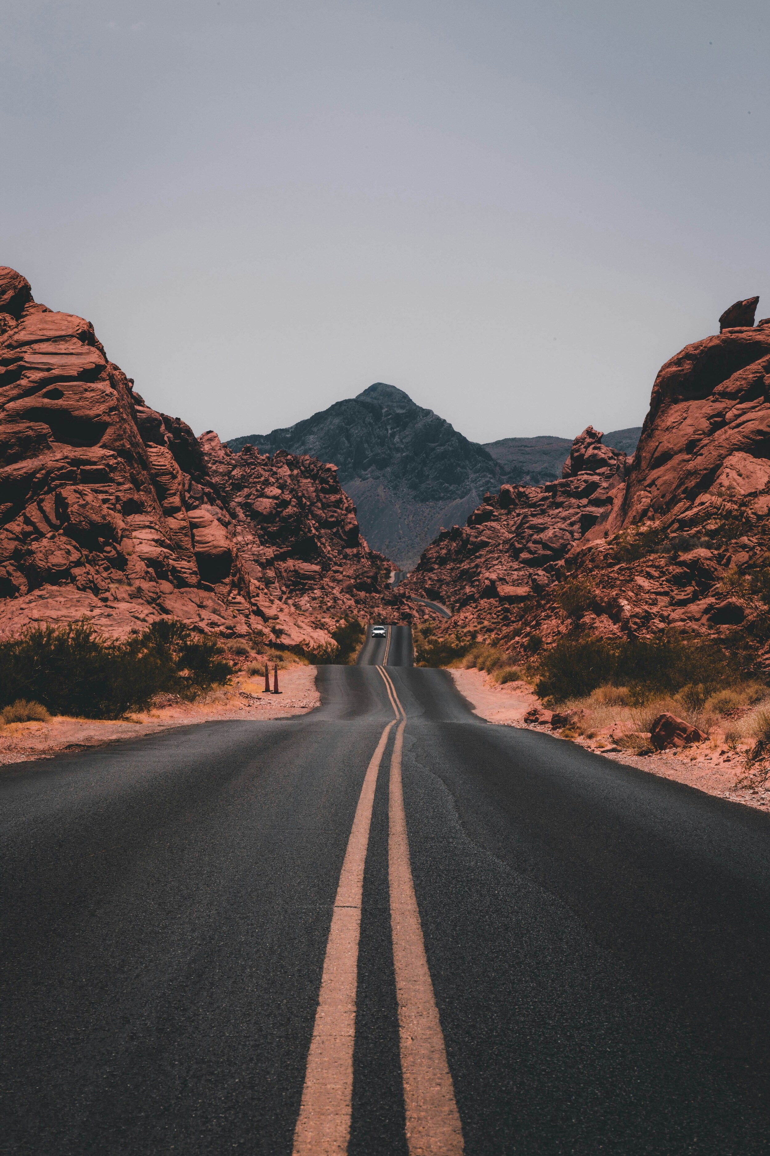 Long Desert Road With Unique Rock Formations Natural Nature Best Free Wallpapers Backgrounds Desktop Pictures For Apple iPad Tablets And Android HD High Resolution 4K wallpaper for Apple iPhone, Apple Watch, Mac, iPad and Apple Watch