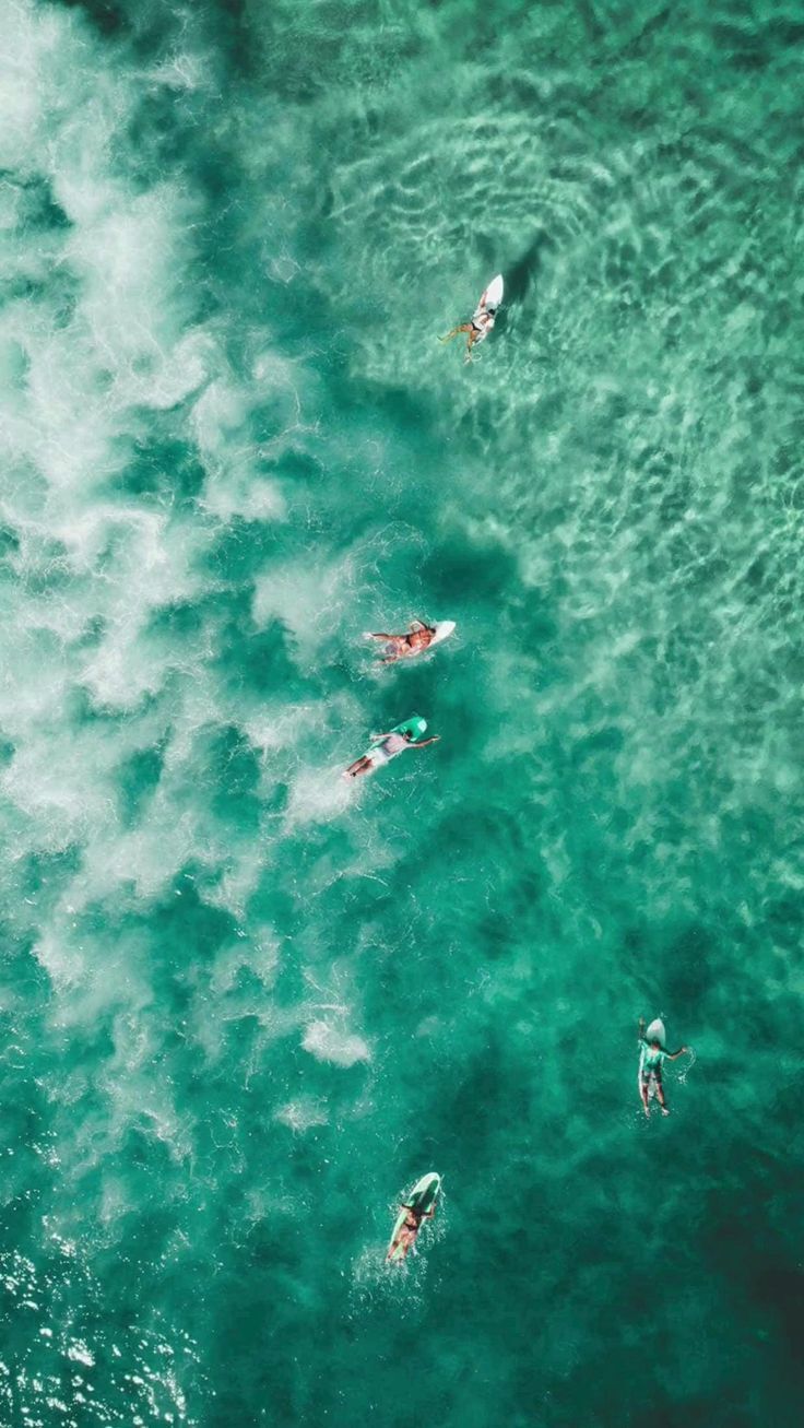 Surfers From Above Green Ocean Water