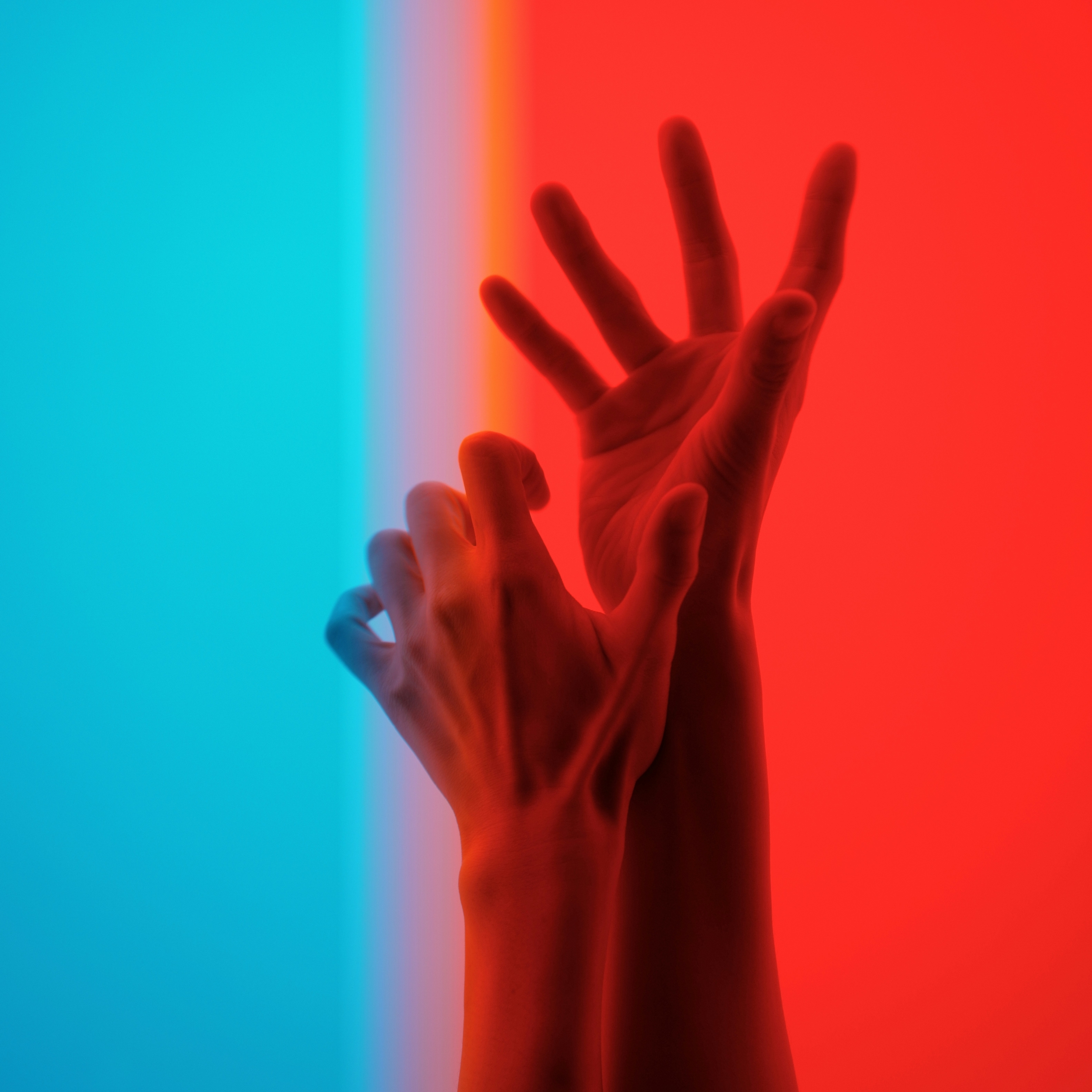 Two Hands Reaching Upwards Red Blue wallpaper for Apple iPhone, Apple Watch, Mac, iPad and Apple Watch