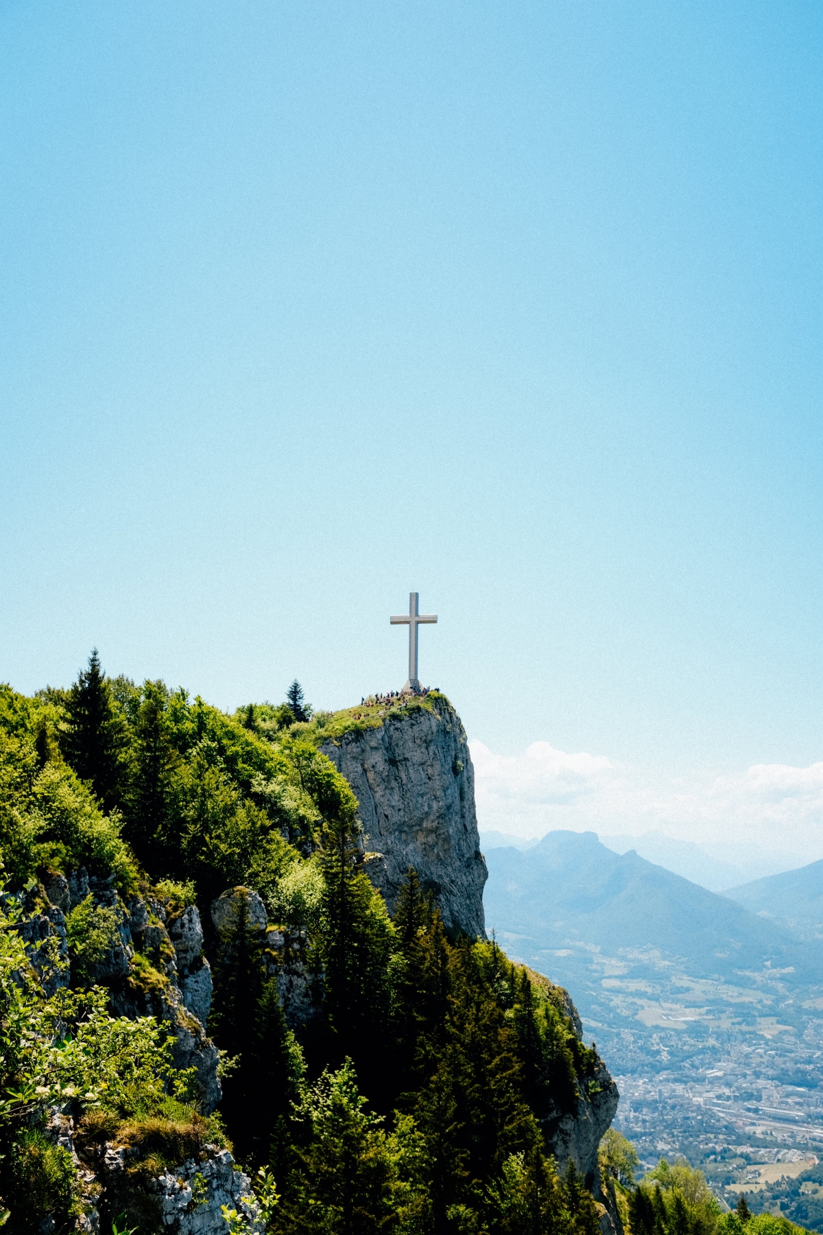 Jesus Christ Cross Stands Tall On The Cliffside