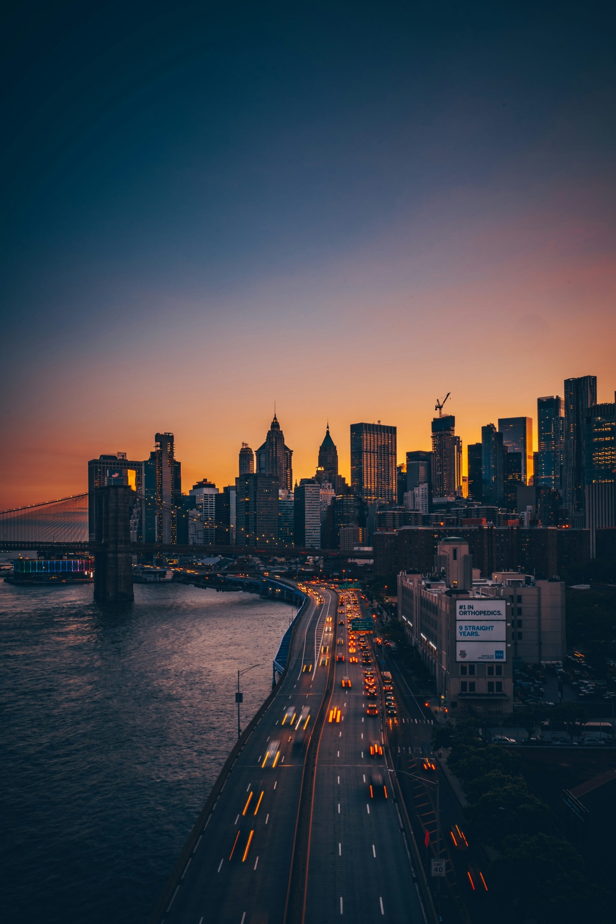 New York City NYC Sunset Twinkling City Lights At Nighttime wallpaper for Apple iPhone, Apple Watch, Mac, iPad and Apple Watch