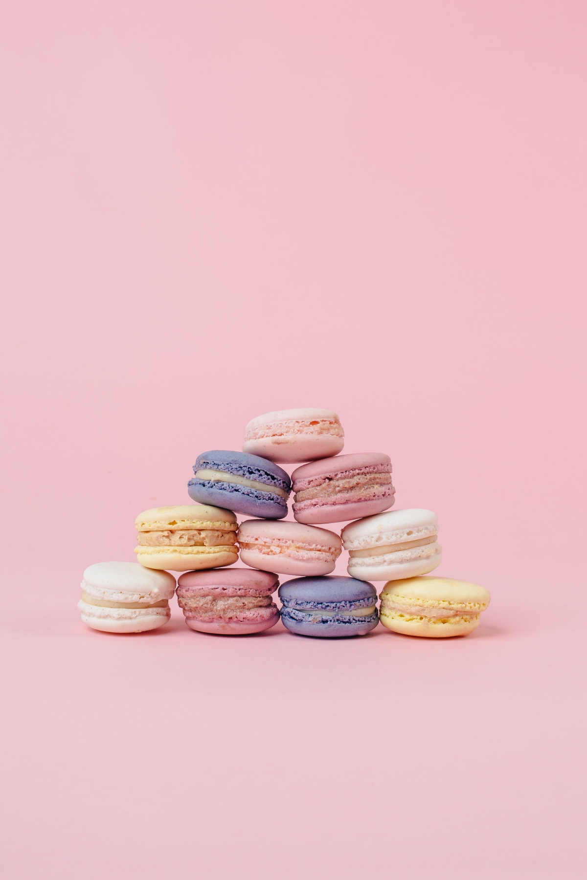 Pastel Macarons In A Pyramid With A Pink Background wallpaper for Apple iPhone, Apple Watch, Mac, iPad and Apple Watch