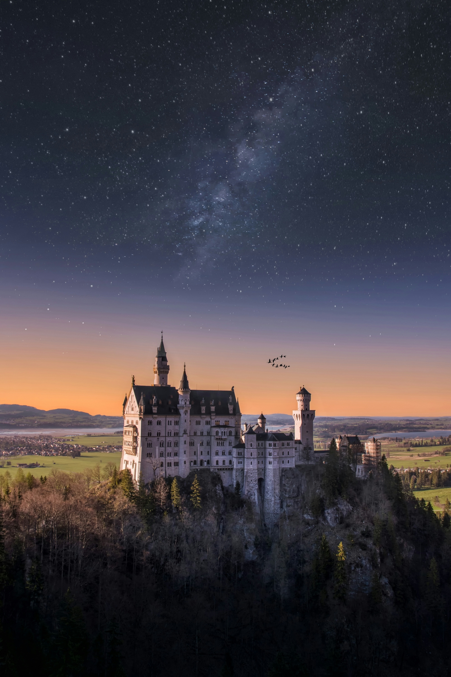 A Medieval Castle On A Hill At Sunset With Flock Of Flying Geese