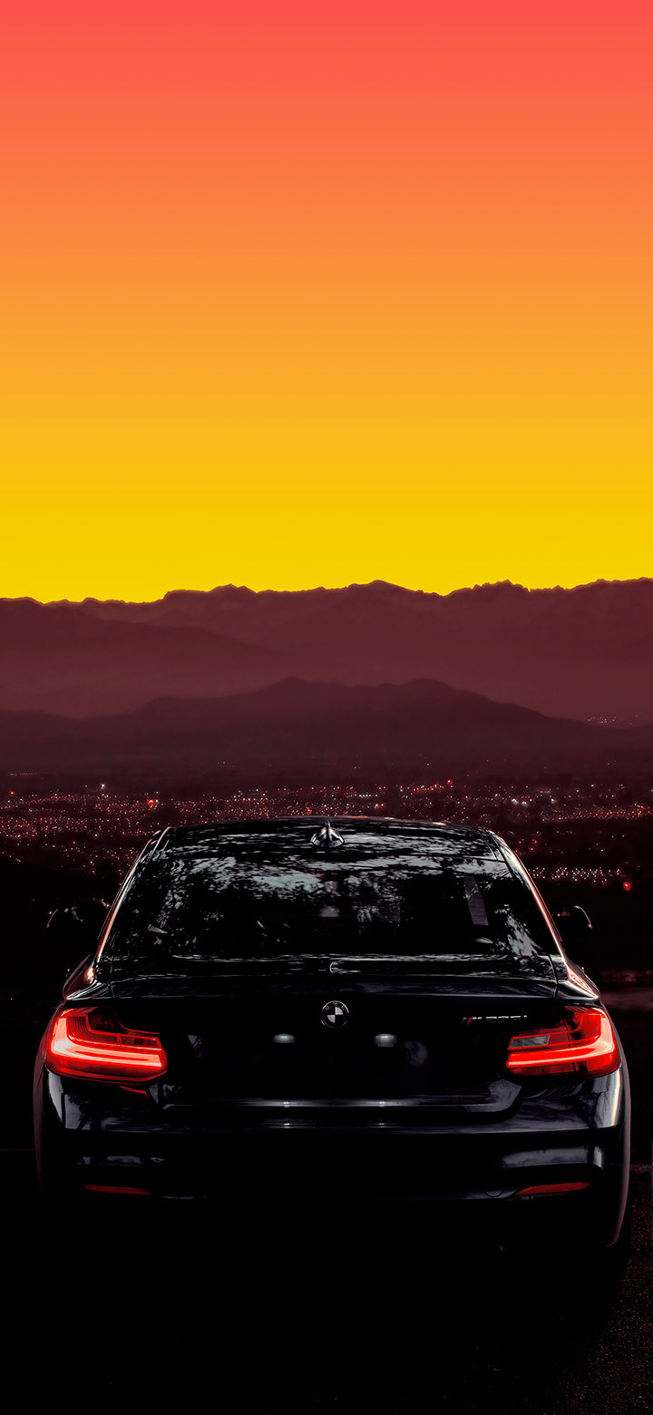 Cool BMW On Road At Sunset Wallpaper