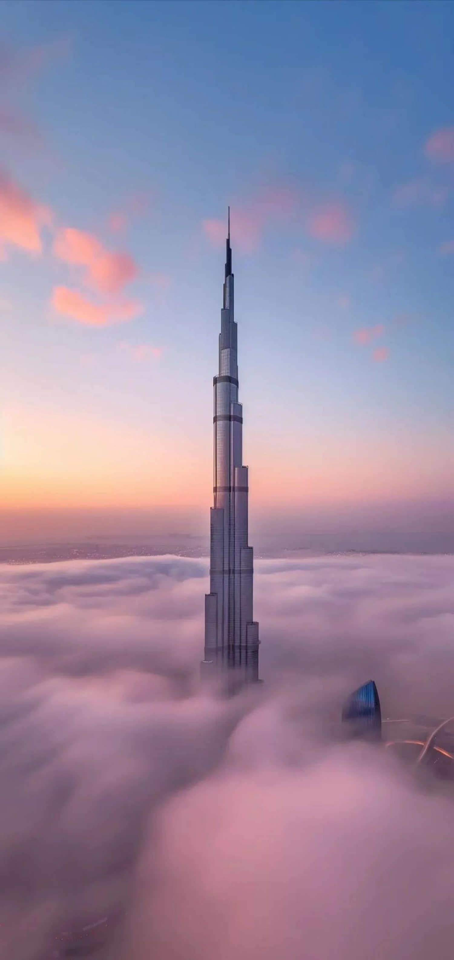 Dubai Burj Khalifa Skyscraper Peeking Above The Clouds