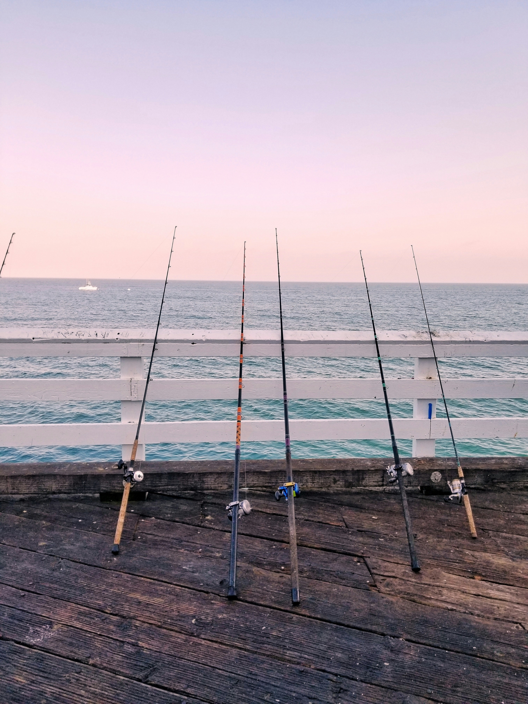 Gone Fishing Fishing Rods On The Pier Ocean Soft Sunset HDR wallpaper for Apple iPhone, Apple Watch, Mac, iPad and Apple Watch