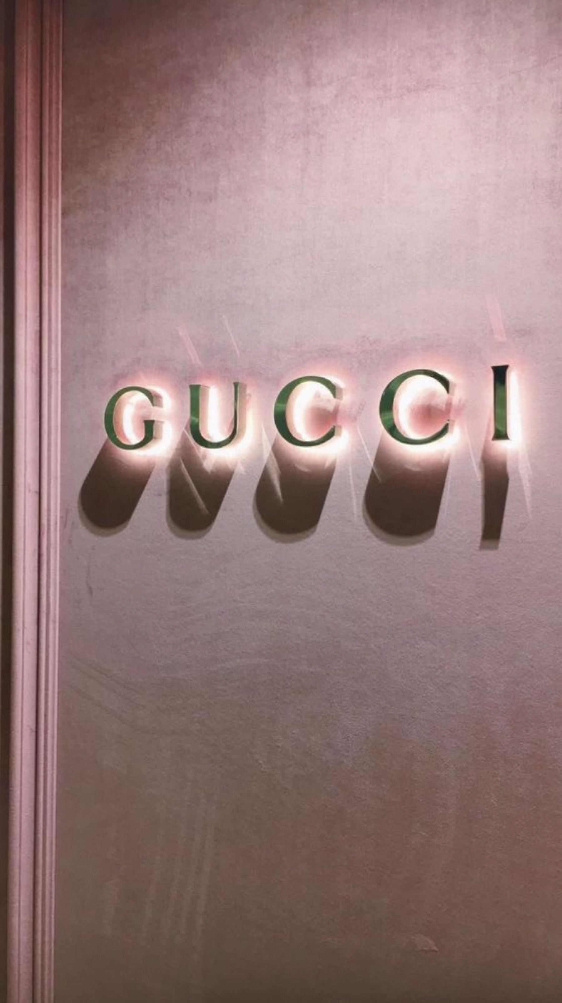 Gucci Logo Glowing Pink And Gold wallpaper for Apple iPhone, Apple Watch, Mac, iPad and Apple Watch