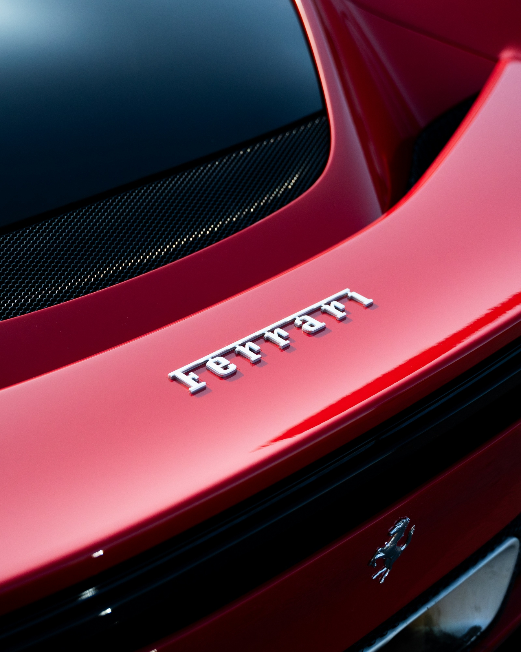 Luxury Ferrari Logo On Red Vehicle