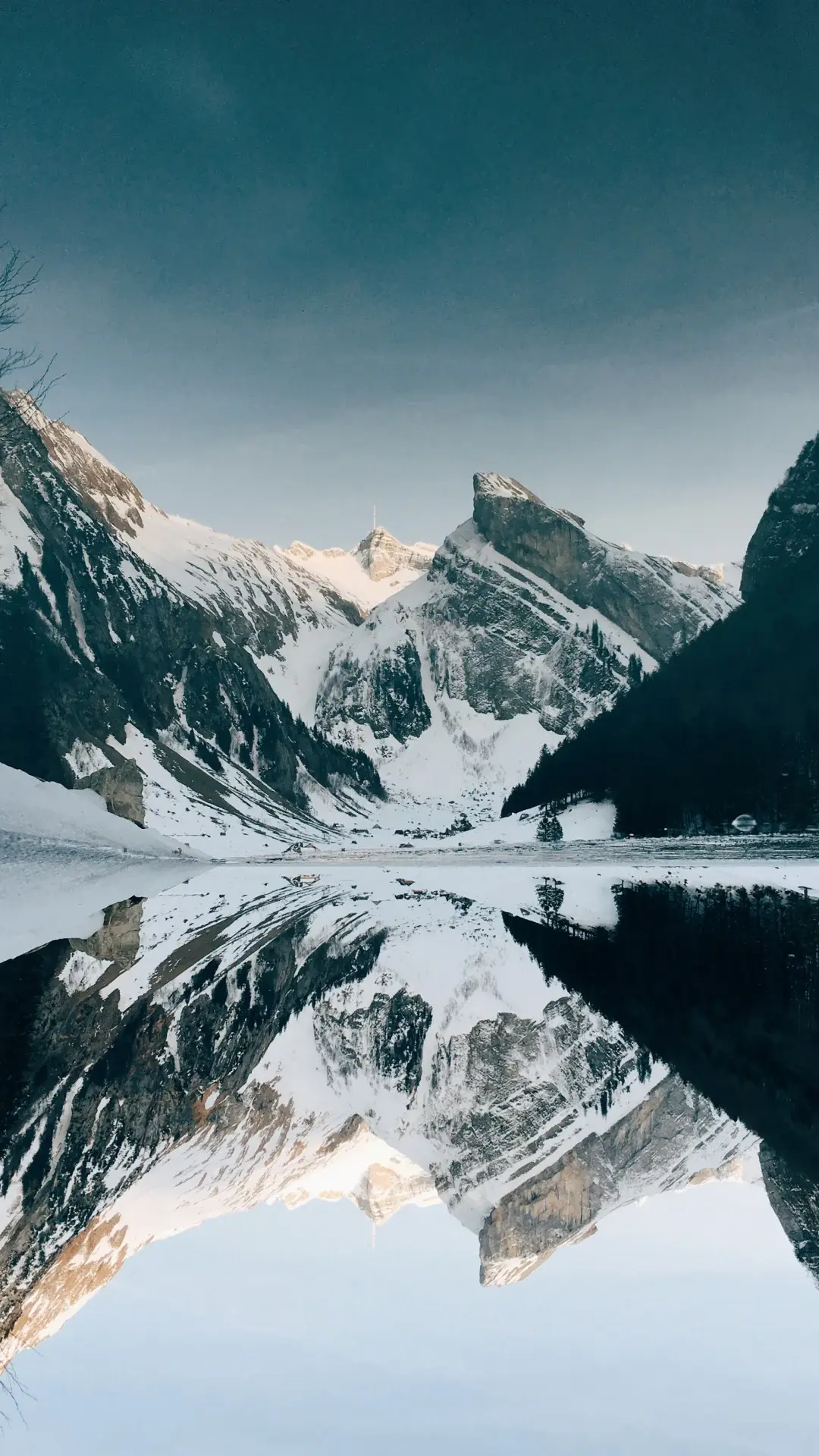 Mountain Landscape With Snowcapped View And Reflections On The Lake