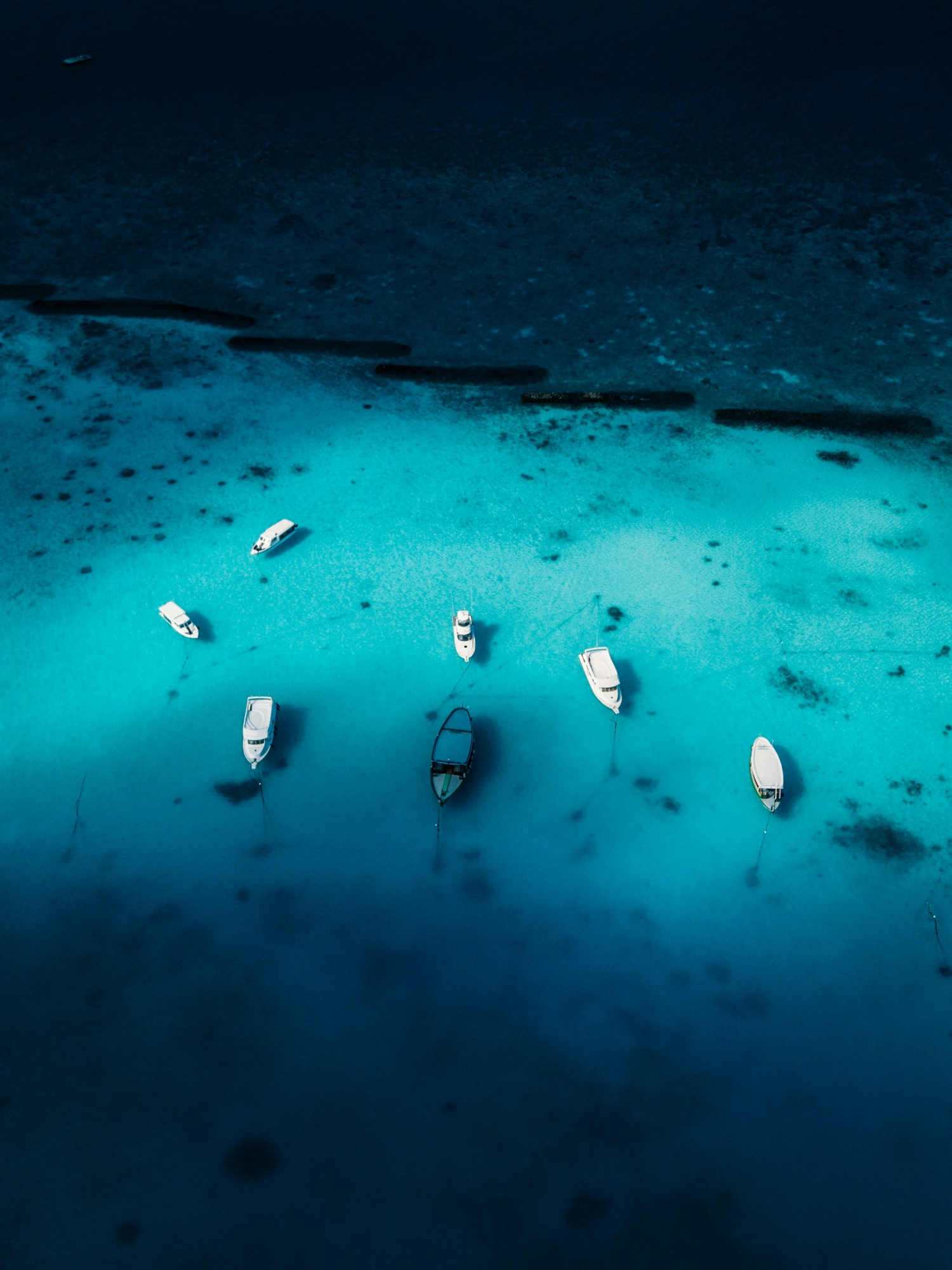 Ocean Water From Above With Boats wallpaper for Apple iPhone, Apple Watch, Mac, iPad and Apple Watch