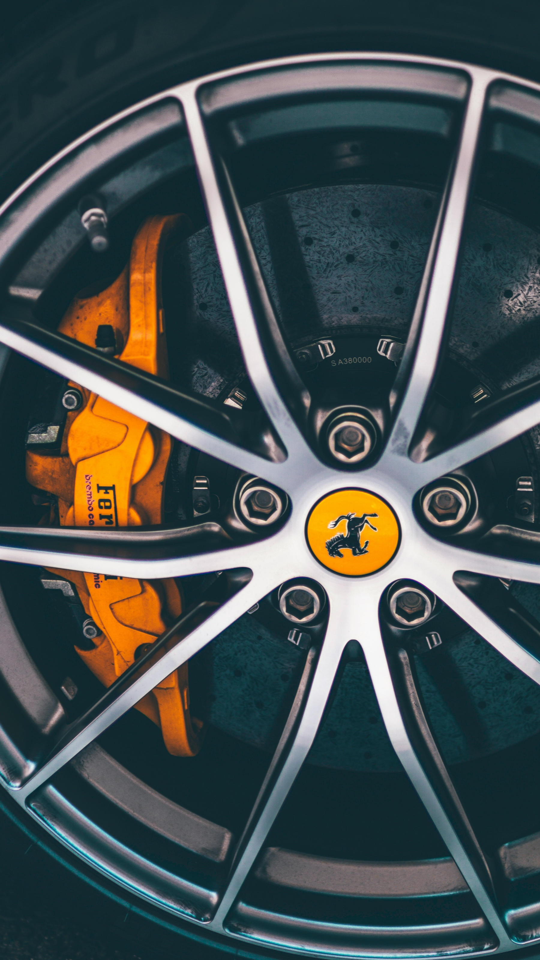 Orange Ferrari Wheel Spokes wallpaper for Apple iPhone, Apple Watch, Mac, iPad and Apple Watch