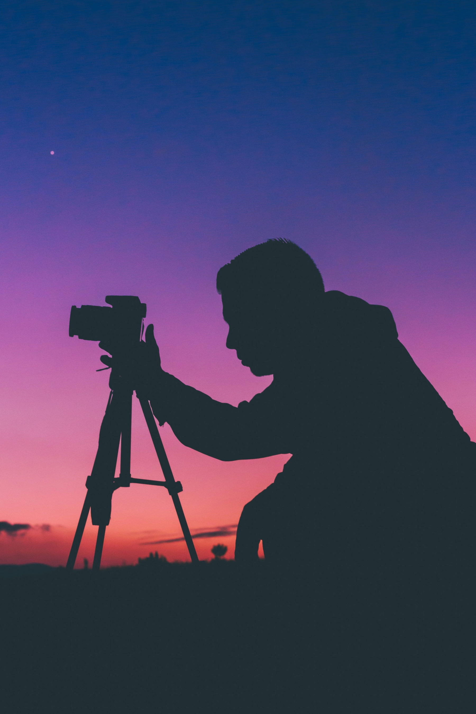 Photographer At Vibrant Sunset Silhouette