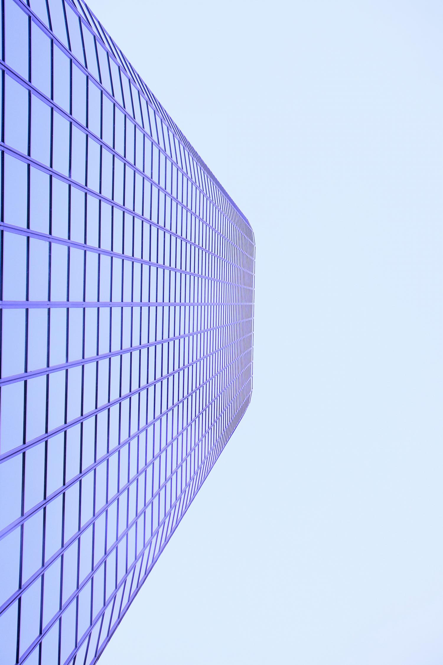 Purple Skyscraper From Below Blue Sky