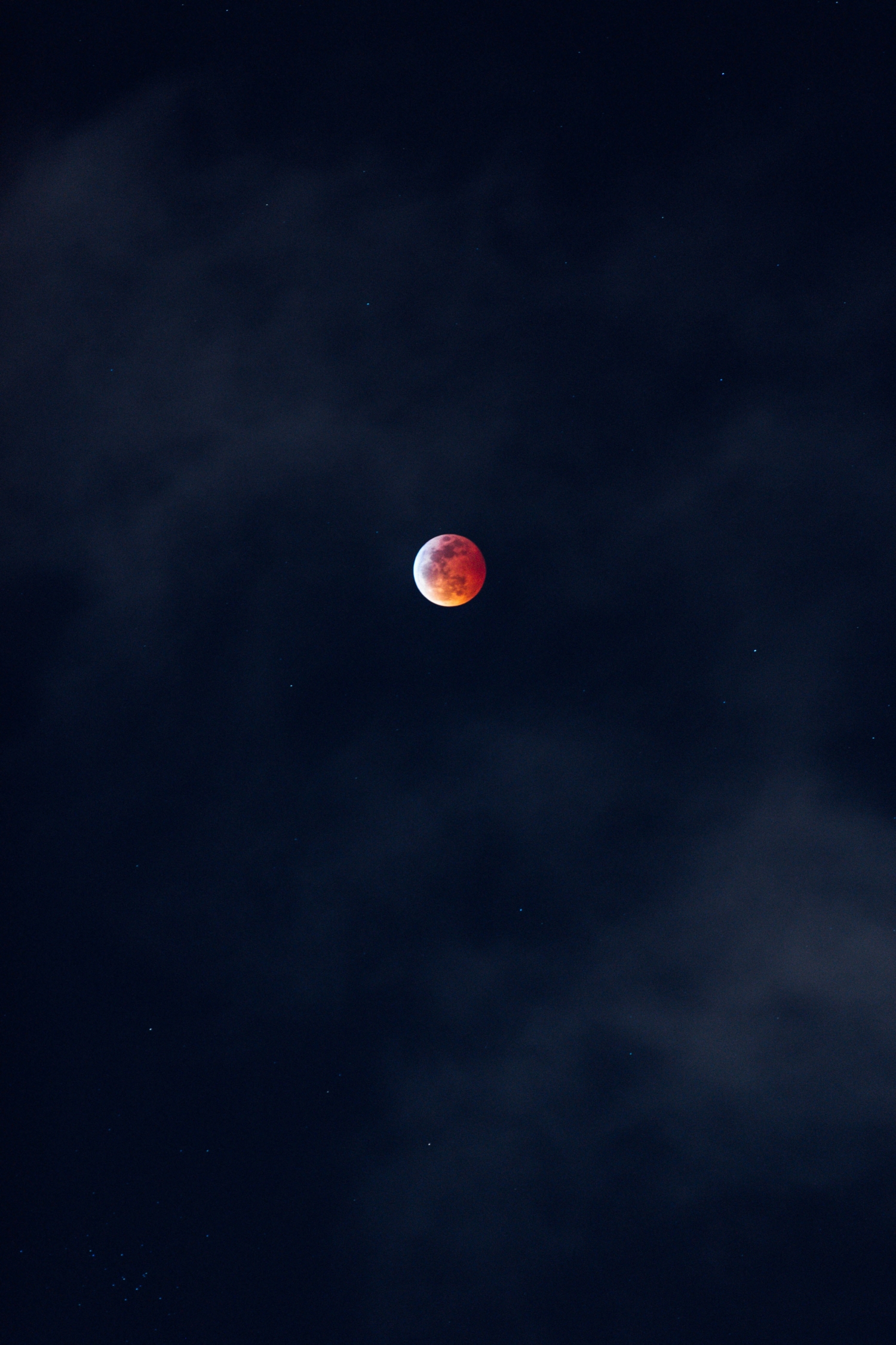 Red Orange Moon In A Dark Star Filled Sky