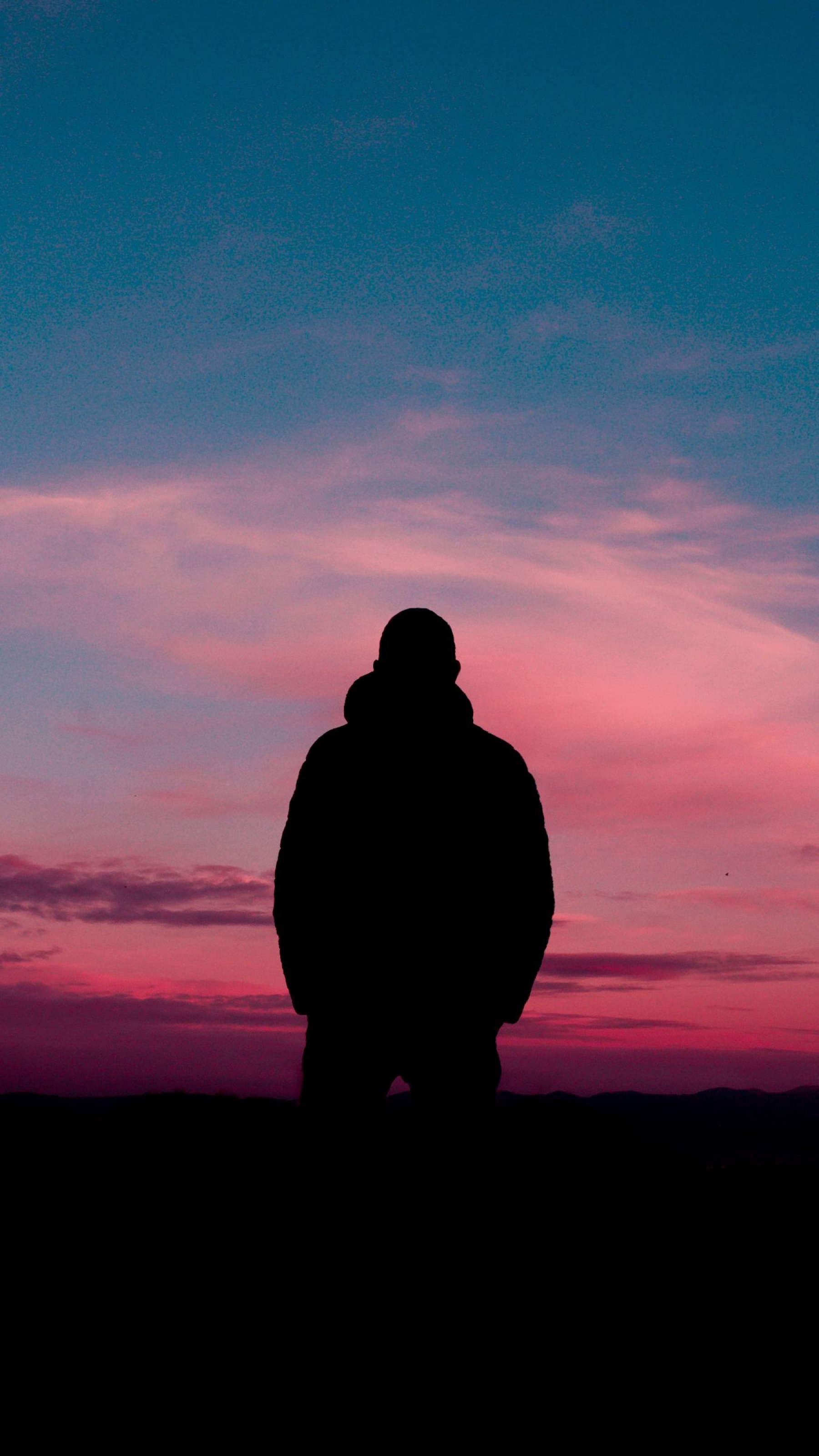 Silhouette Of A Lonely Man In Front Of The Sunset