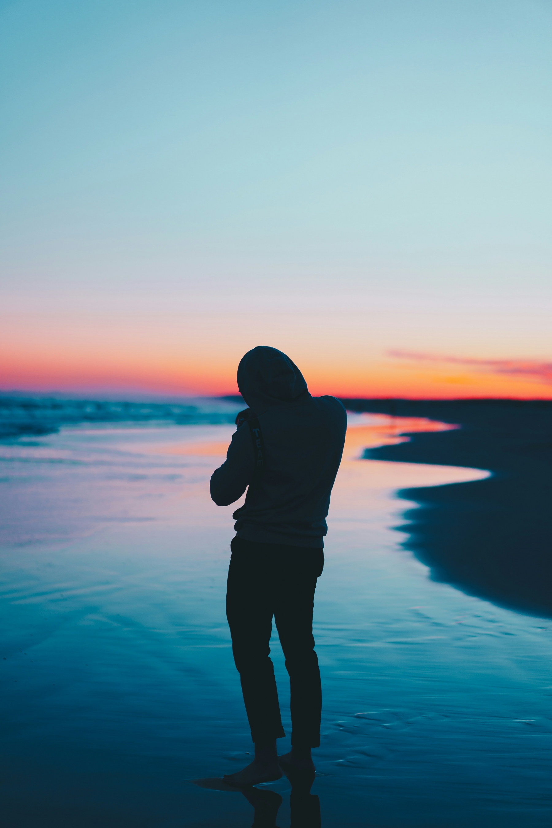 Silhouette Of Man At The Beach wallpaper for Apple iPhone, Apple Watch, Mac, iPad and Apple Watch