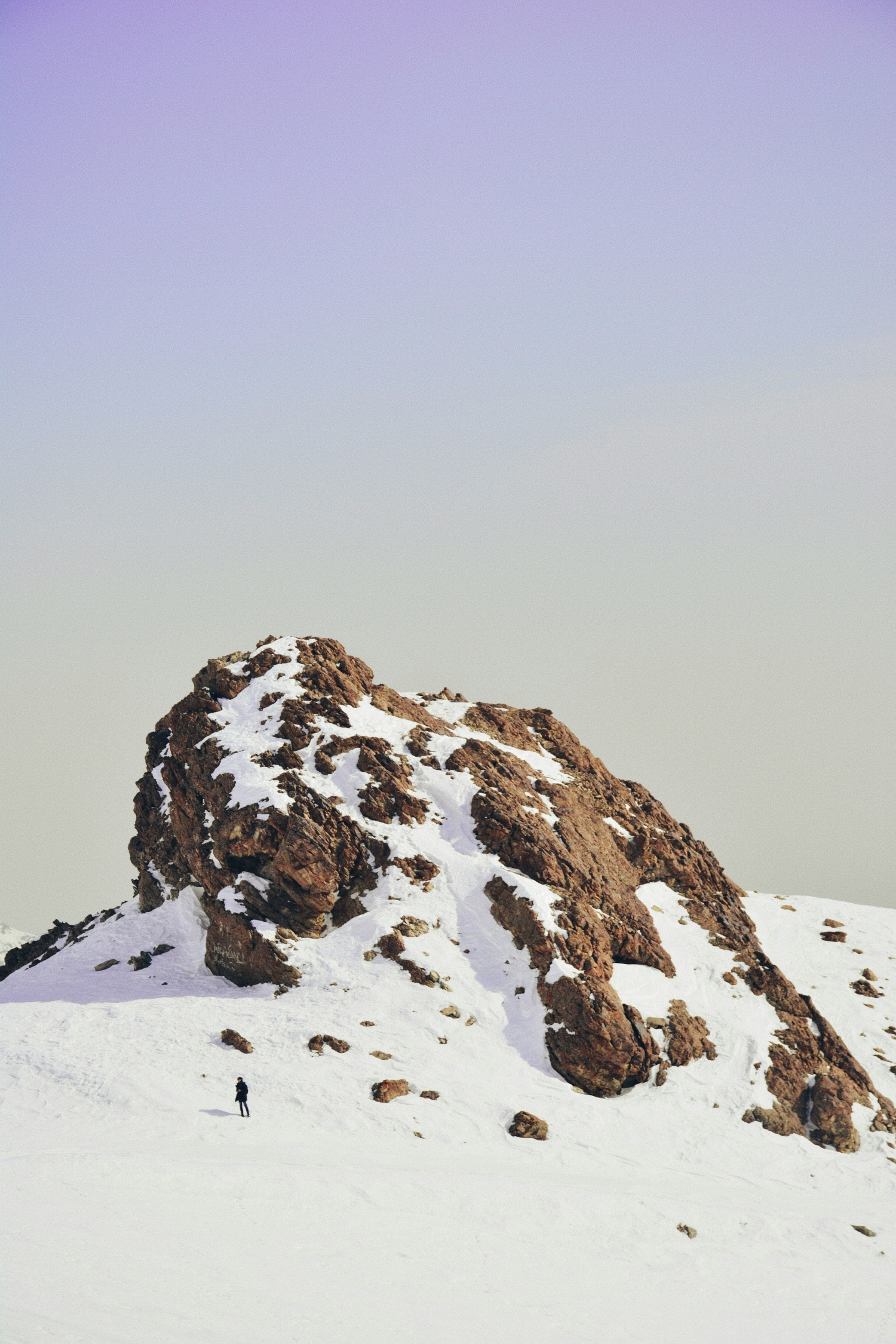 Single Guy Walking Alone In The Snow With Gorgeous Snowcapped Mountain Landscape Nature Behind Him