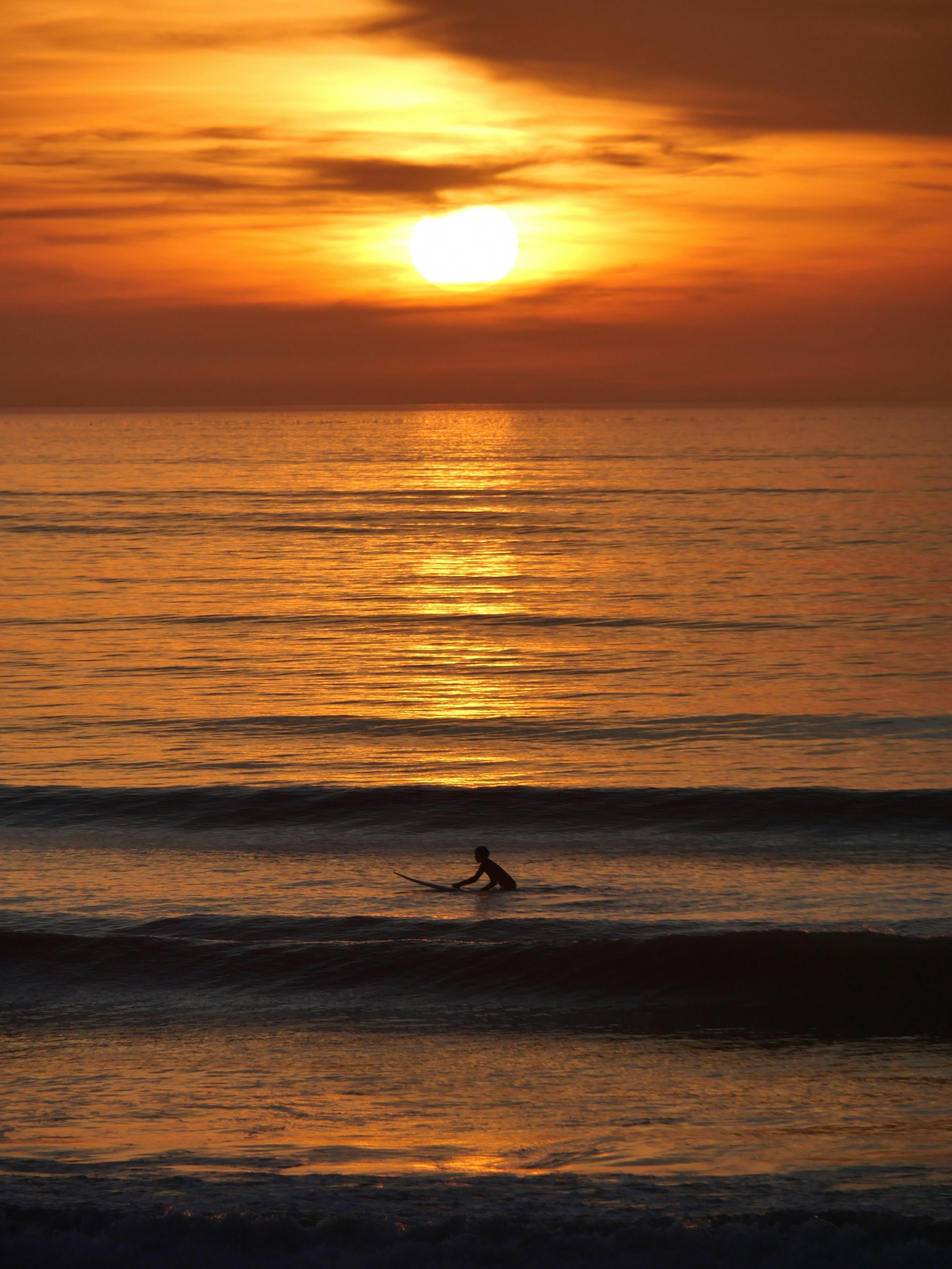 Surfer On The Beach Sunset wallpaper for Apple iPhone, Apple Watch, Mac, iPad and Apple Watch