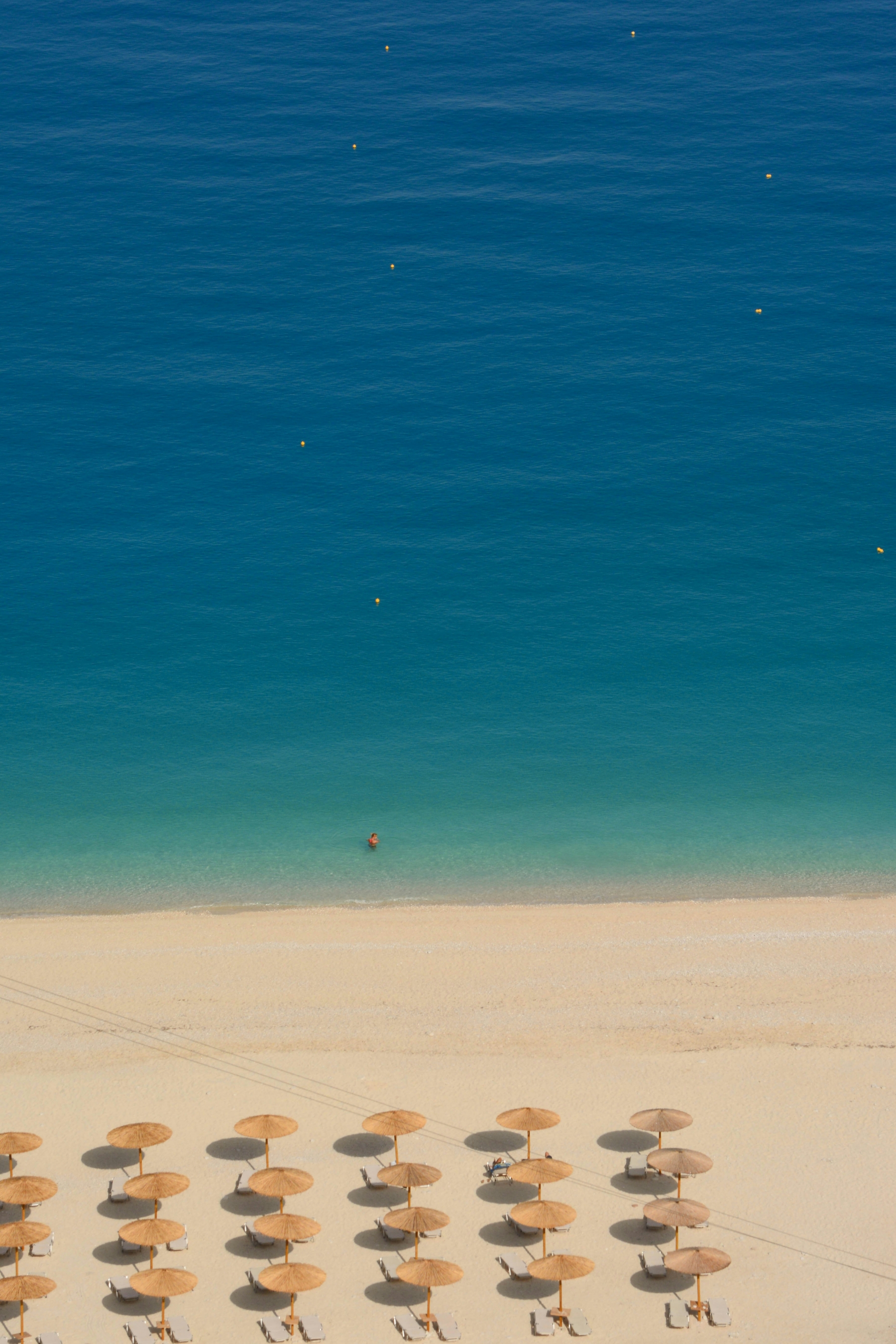 Umbrellas On A Beach Drone Shot HDR wallpaper for Apple iPhone, Apple Watch, Mac, iPad and Apple Watch