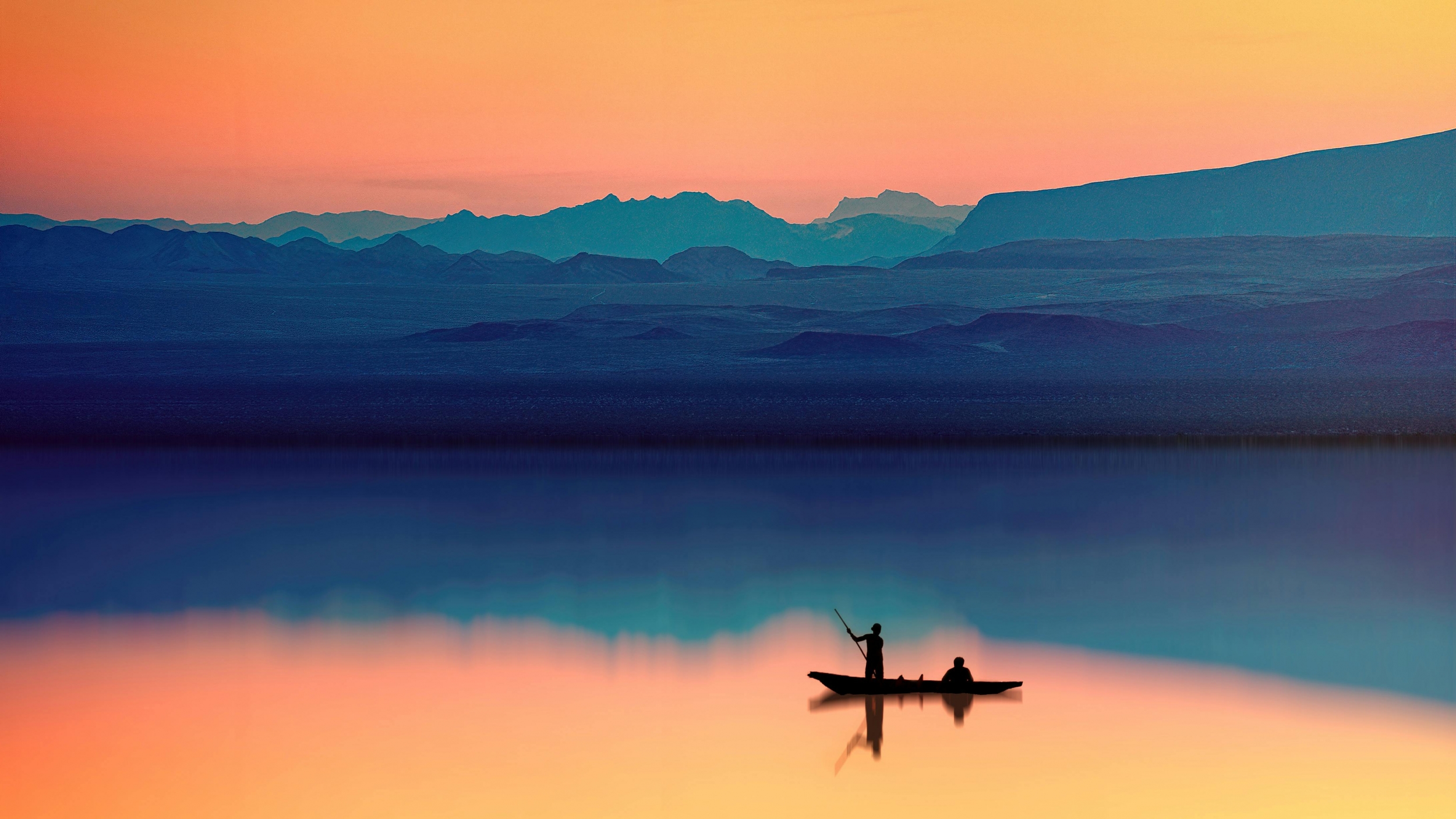 A Man Fishing On The Lake Amidst A Vibrant Orange Sunset With Mountains Landscap