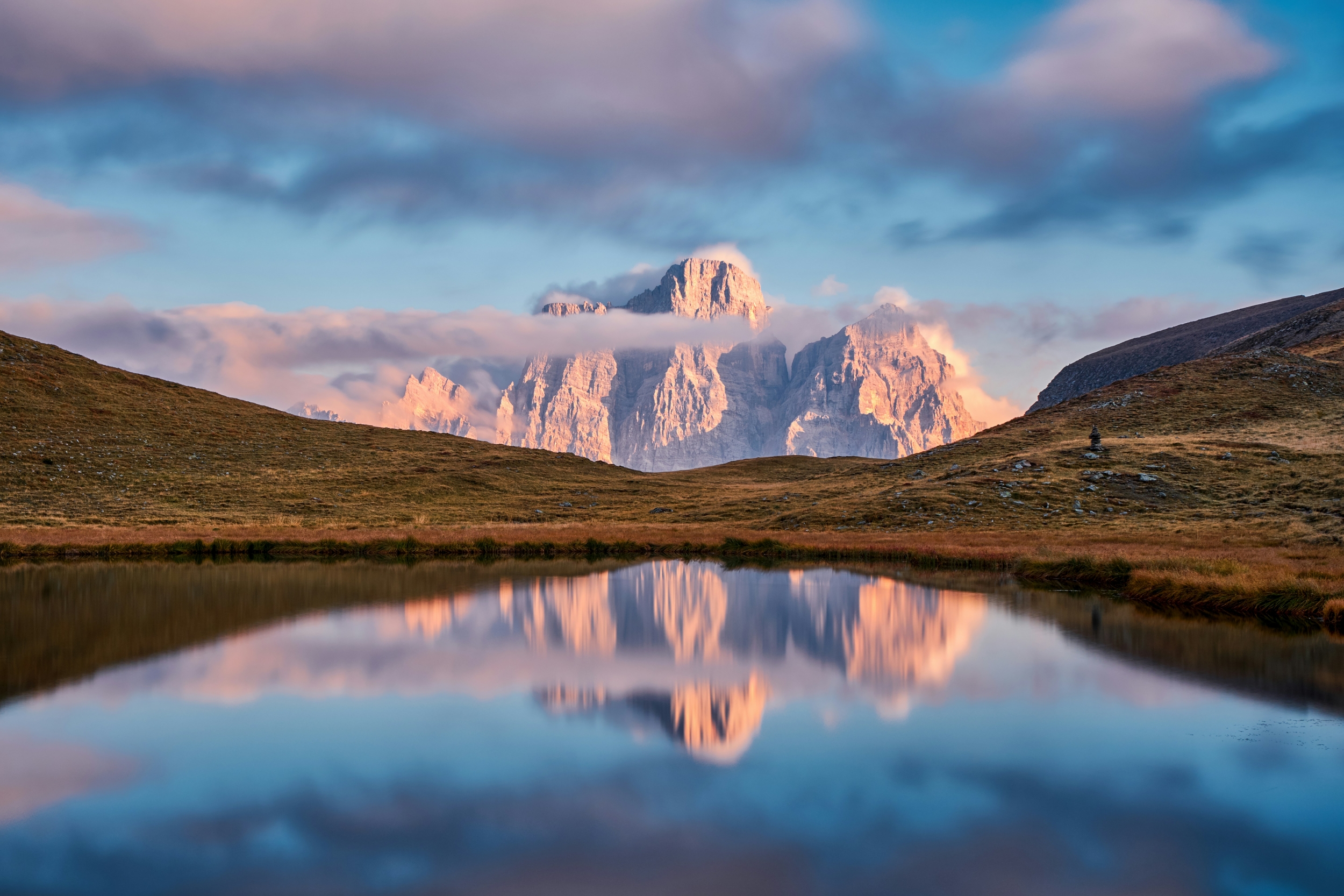 Beautiful Stunning Snowcapped Mountain At Sunrise With Clouds Landscape Nature Lake Reflecting Sun Winter