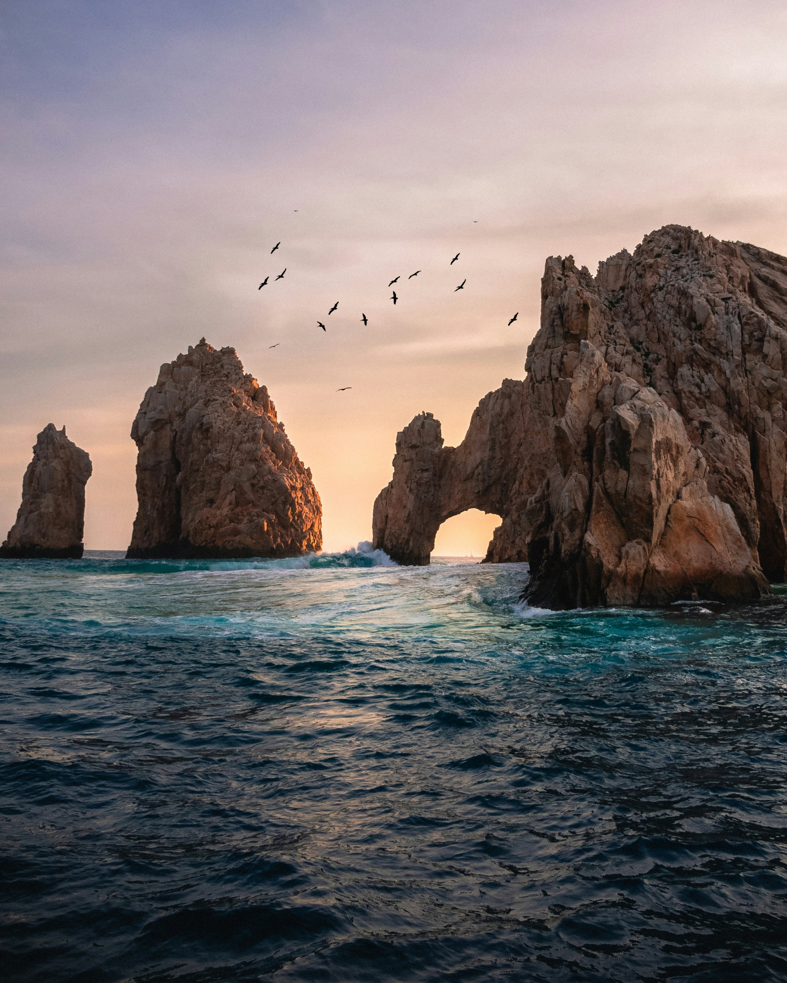 Birds Circle Around Three Big Rock Islands In The Ocean HD 4K