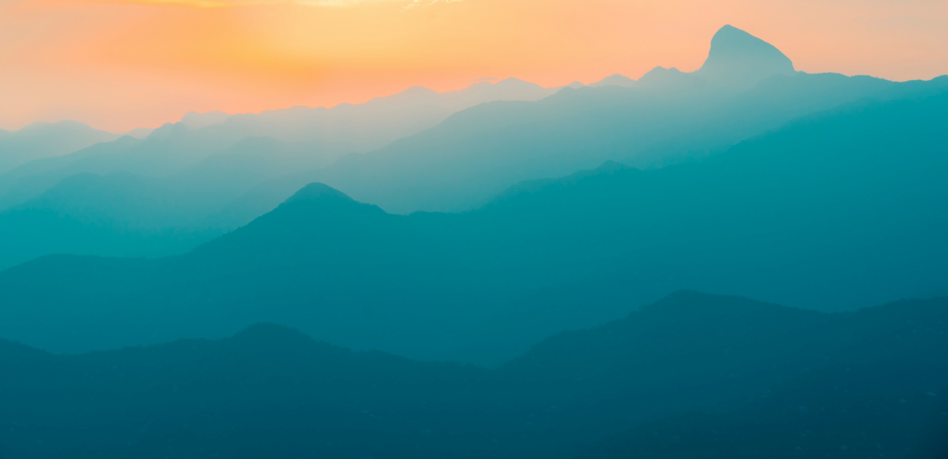 Blue Silhouette Of Mountains Sunrise