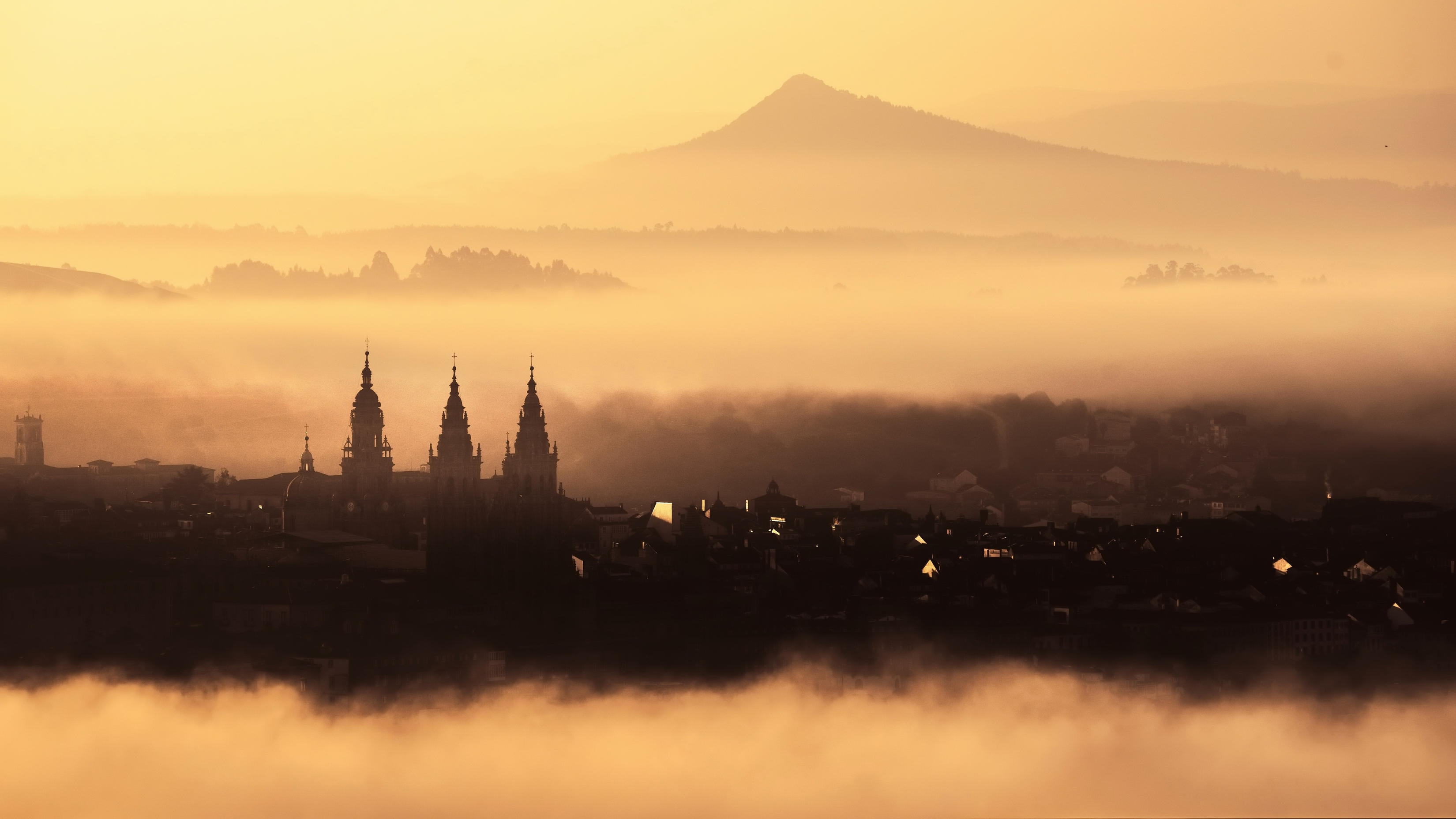 Church Towers On A Misty Early Morning Fog 2025 Best Ultra HD High Resolution 4K Desktop Backgrounds Wallpapers For Mac Linux And Windows PC wallpaper for Apple iPhone, Apple Watch, Mac, iPad and Apple Watch