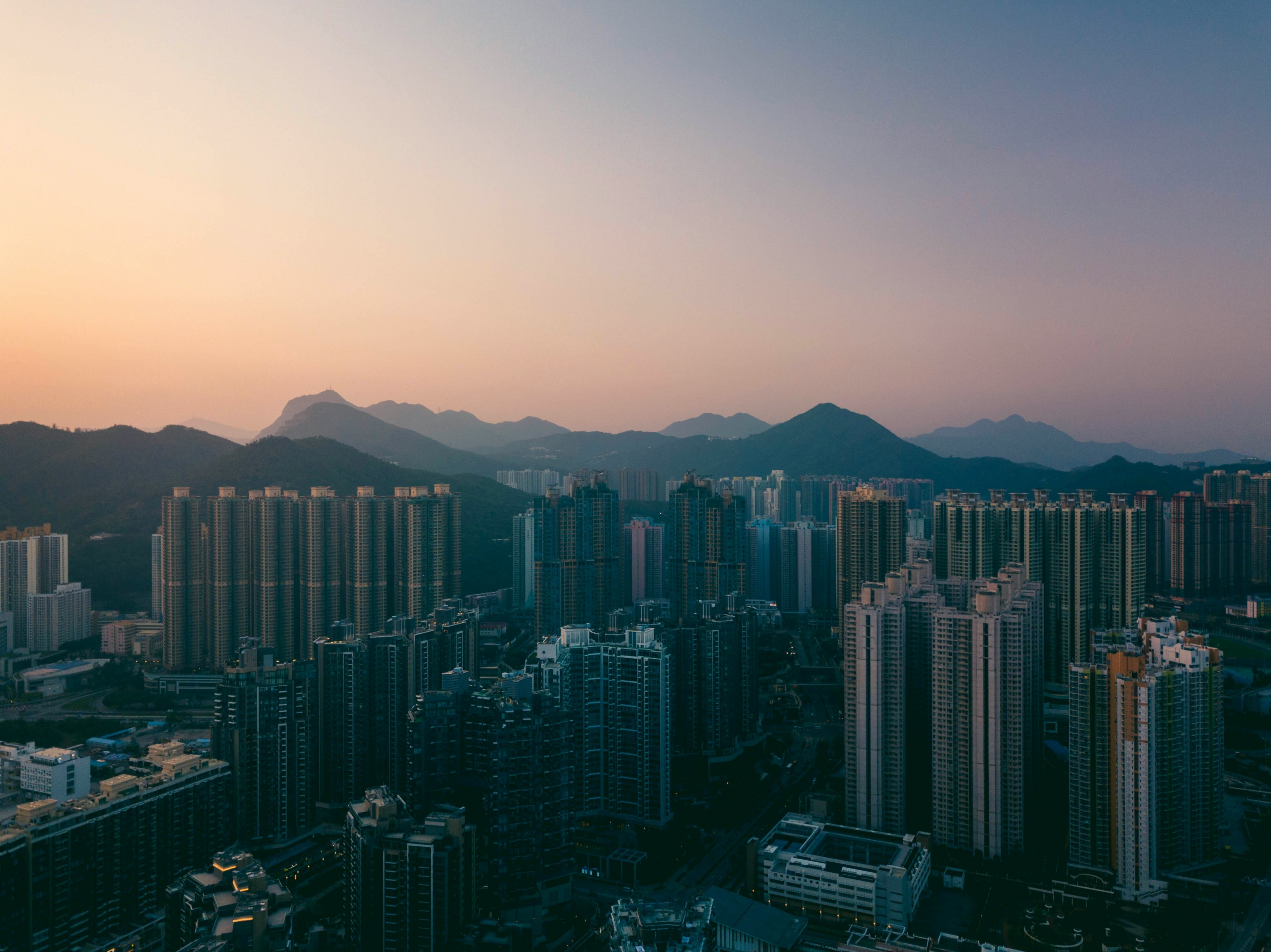 Hong Kong China City Skyline Smoggy Sunset wallpaper for Apple iPhone, Apple Watch, Mac, iPad and Apple Watch