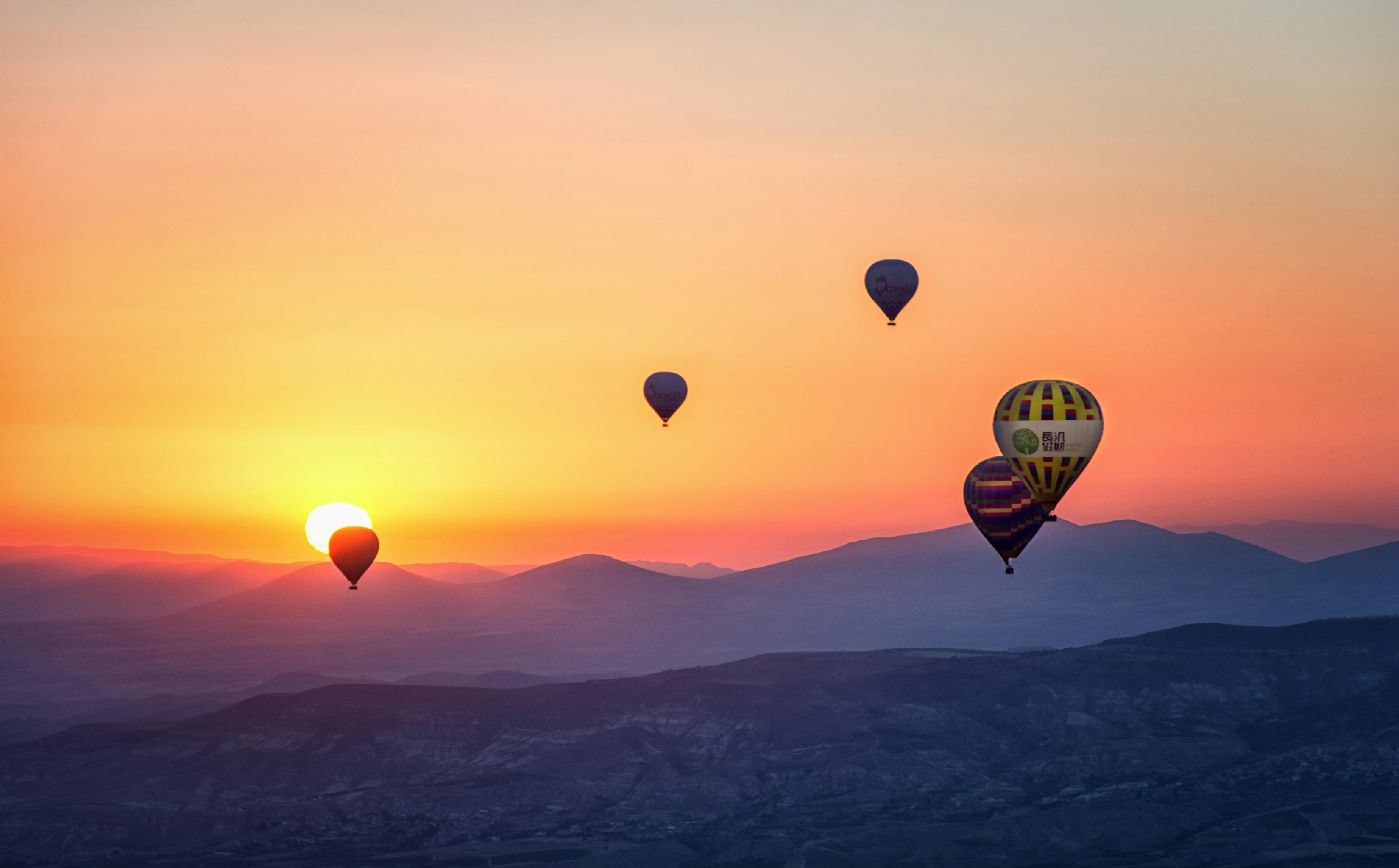 Hot Air Balloons Fly Into The Sunset