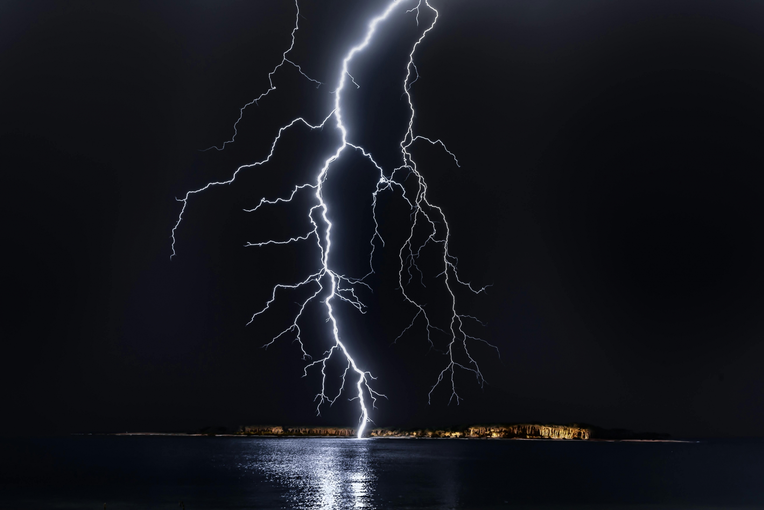 Intense Lightning Bolt Hits A Small Town With Lights