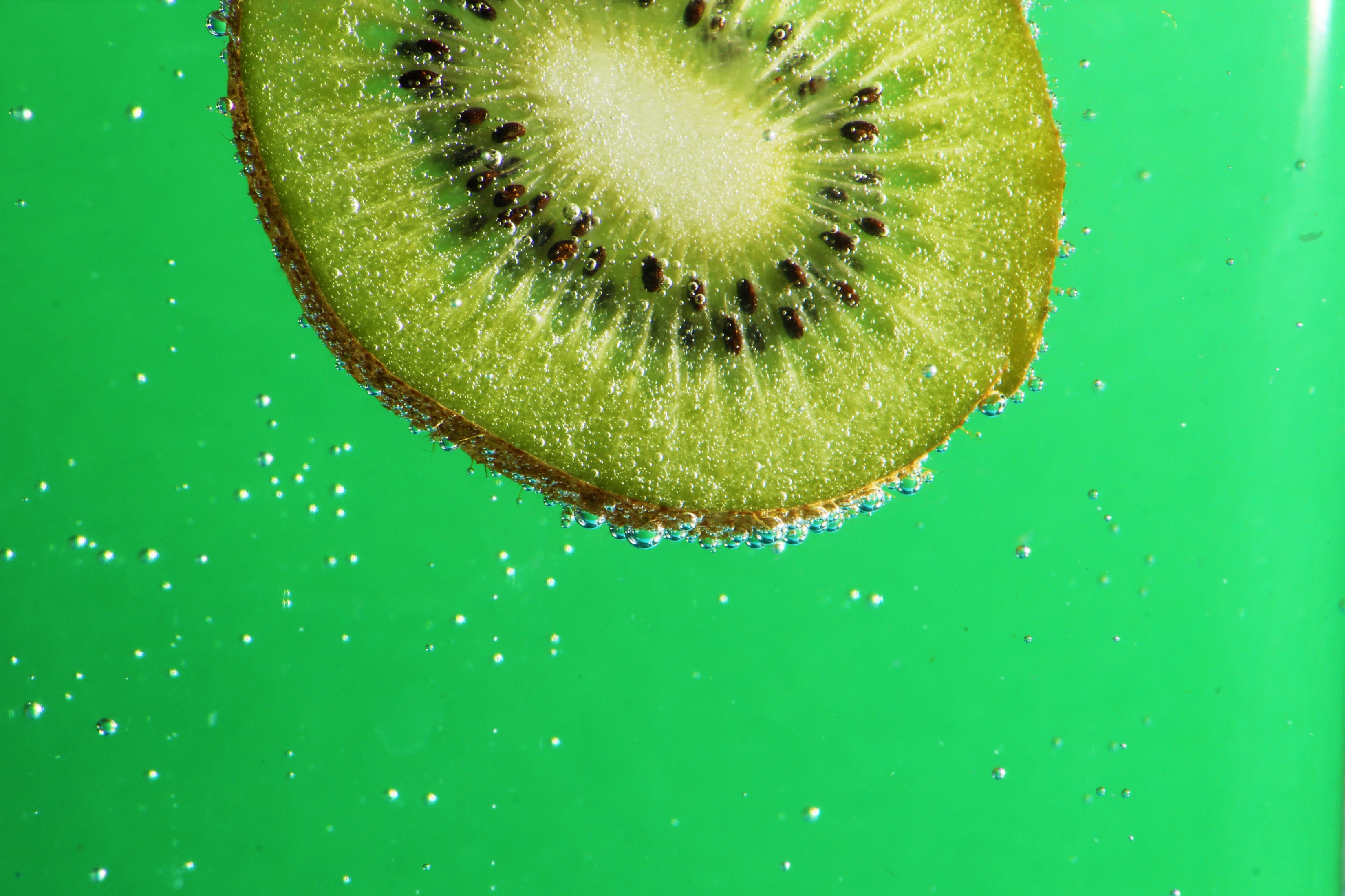 Kiwifruit Green Background With Bubbles wallpaper for Apple iPhone, Apple Watch, Mac, iPad and Apple Watch