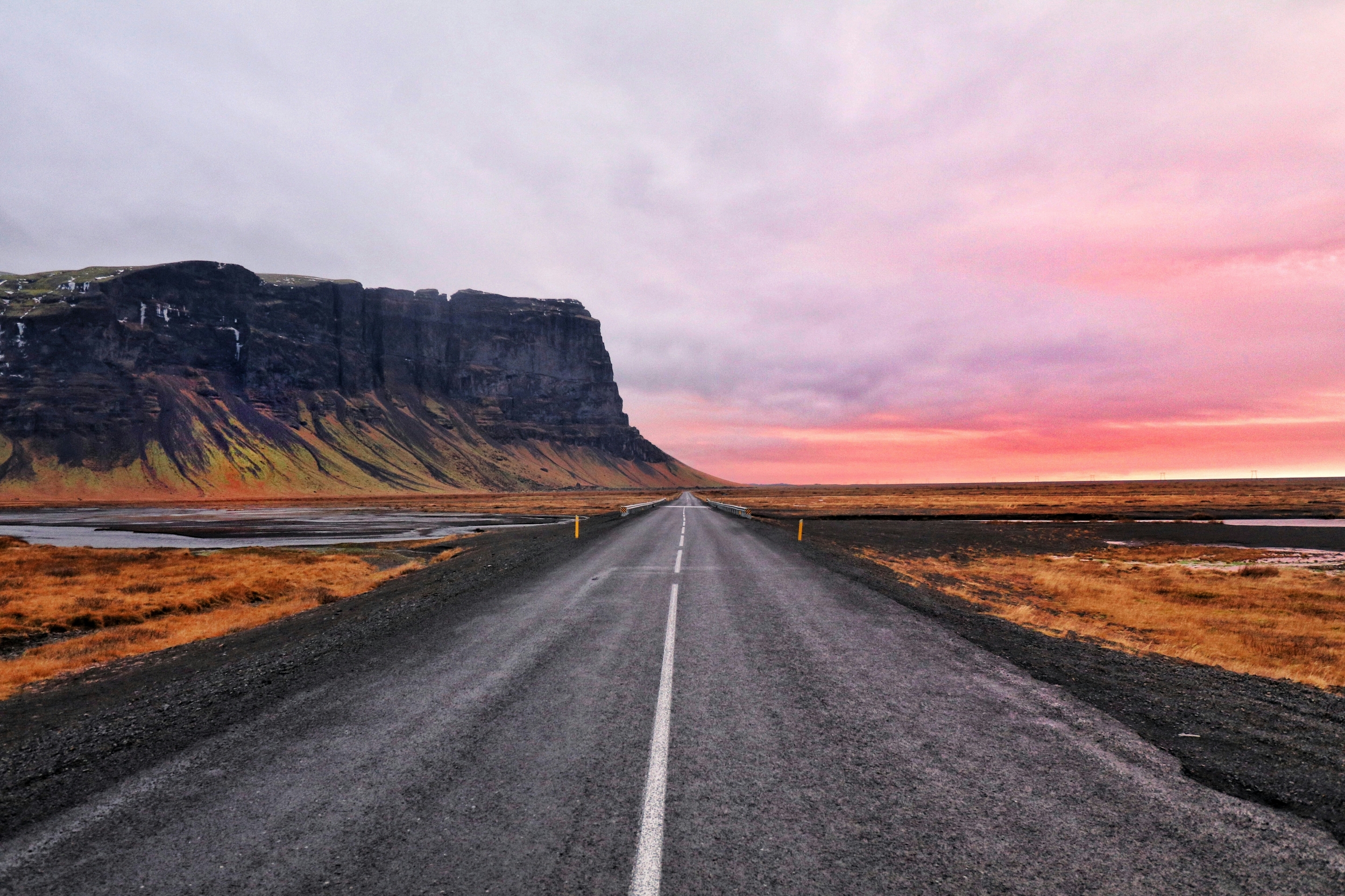 Long Stretch Of Road Barren Landscape Sunset