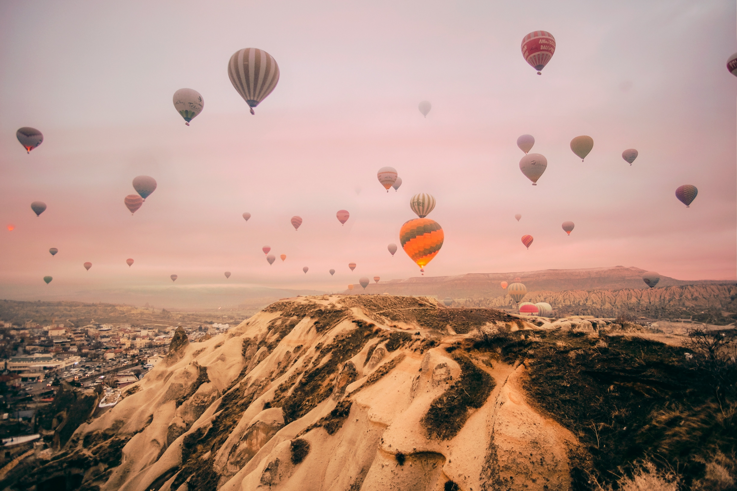 Many Hot Air Balloons Fly At Sunrise