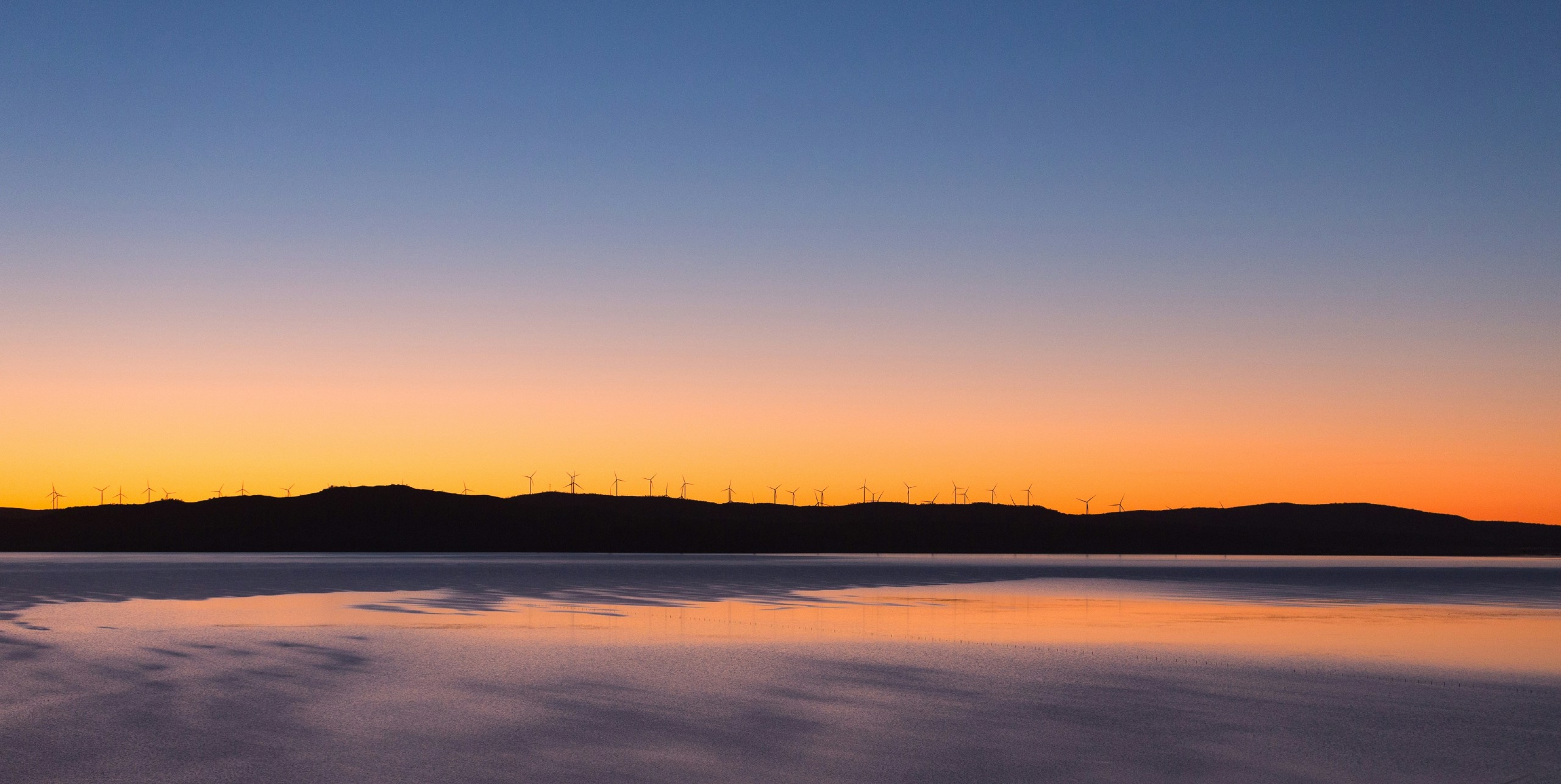 Orange Vibrant Sunset Above The Water