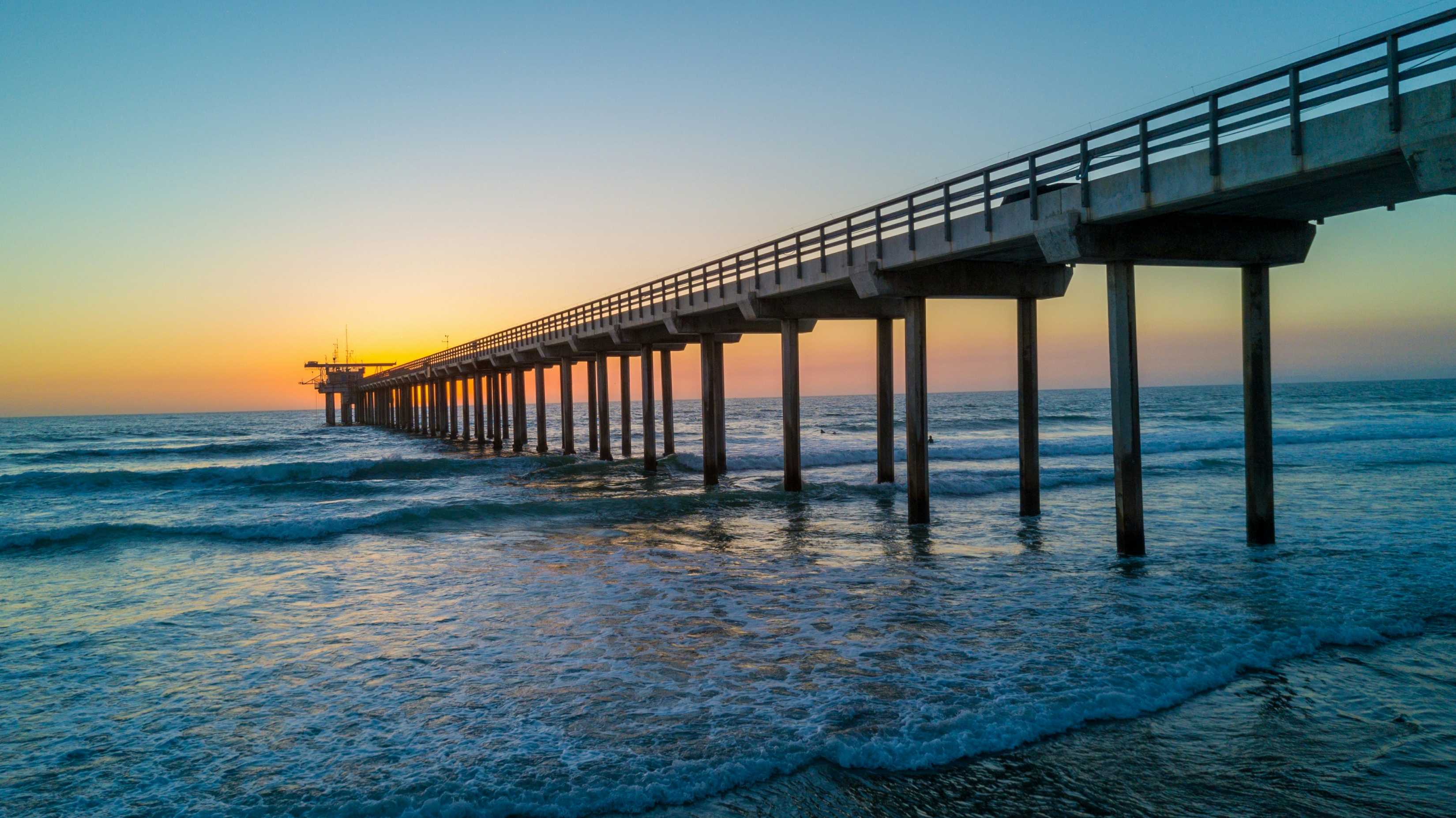 Pier By The Beach Bright Orange Sunset 4K