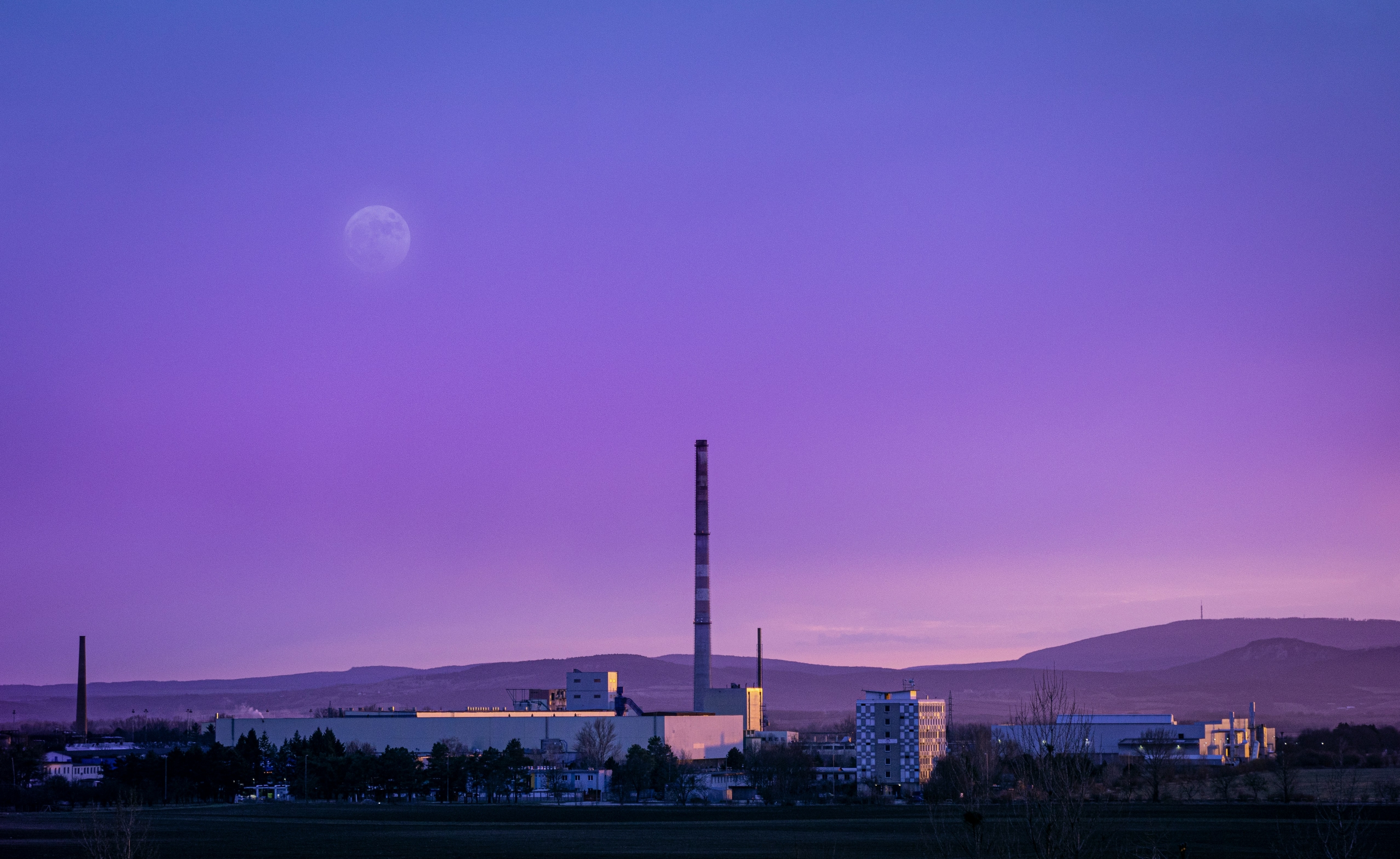 Purple Sky At Night Over Huge Factory Chimney