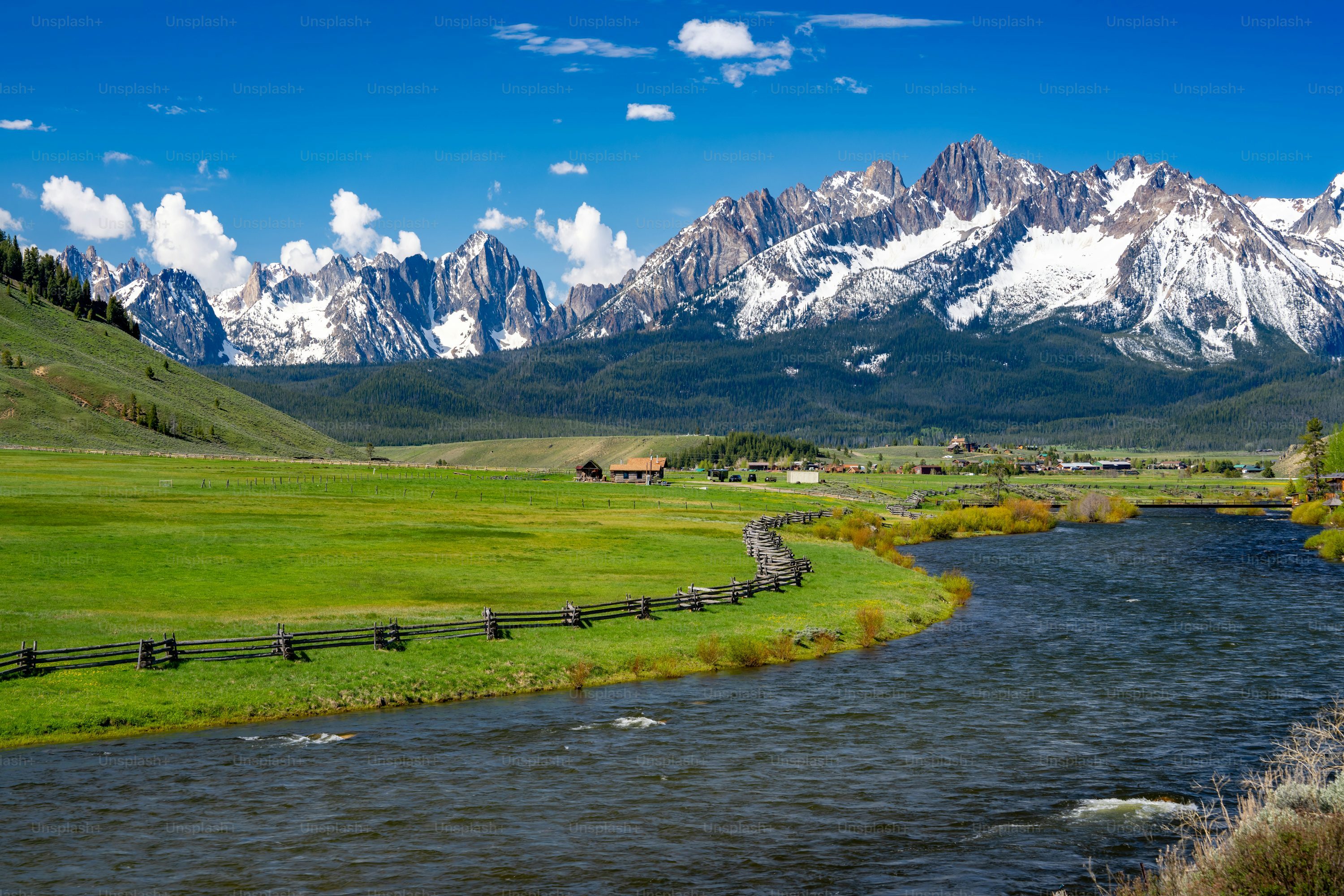 Snowcapped Mountains And Rolling Green Grass Idaho State United States USA