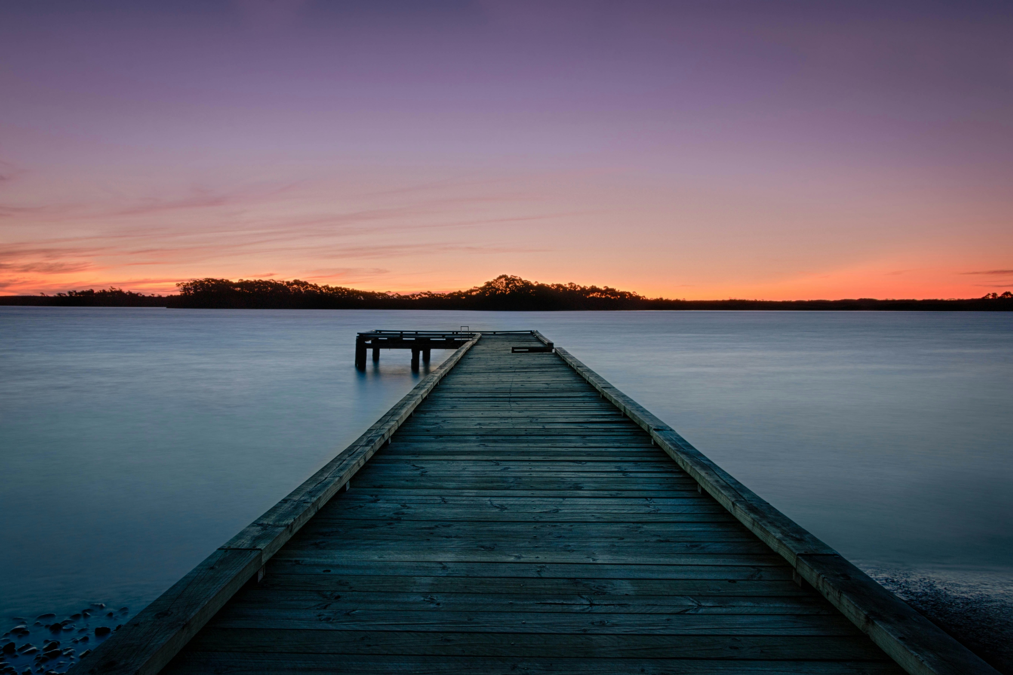 Sunset At The Pier With Mountains Water wallpaper for Apple iPhone, Apple Watch, Mac, iPad and Apple Watch