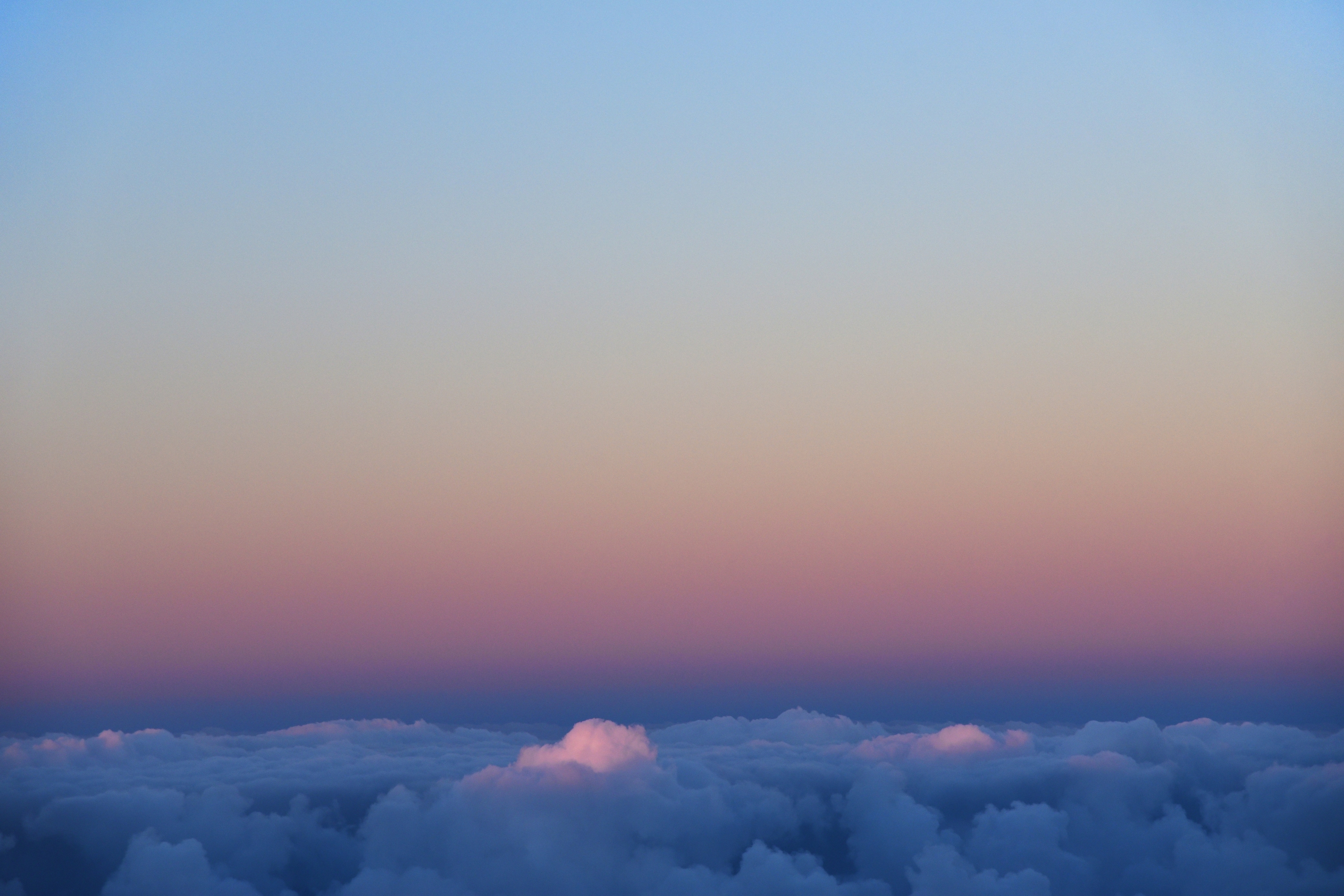 Sunset View From Plane Window Above The Clouds