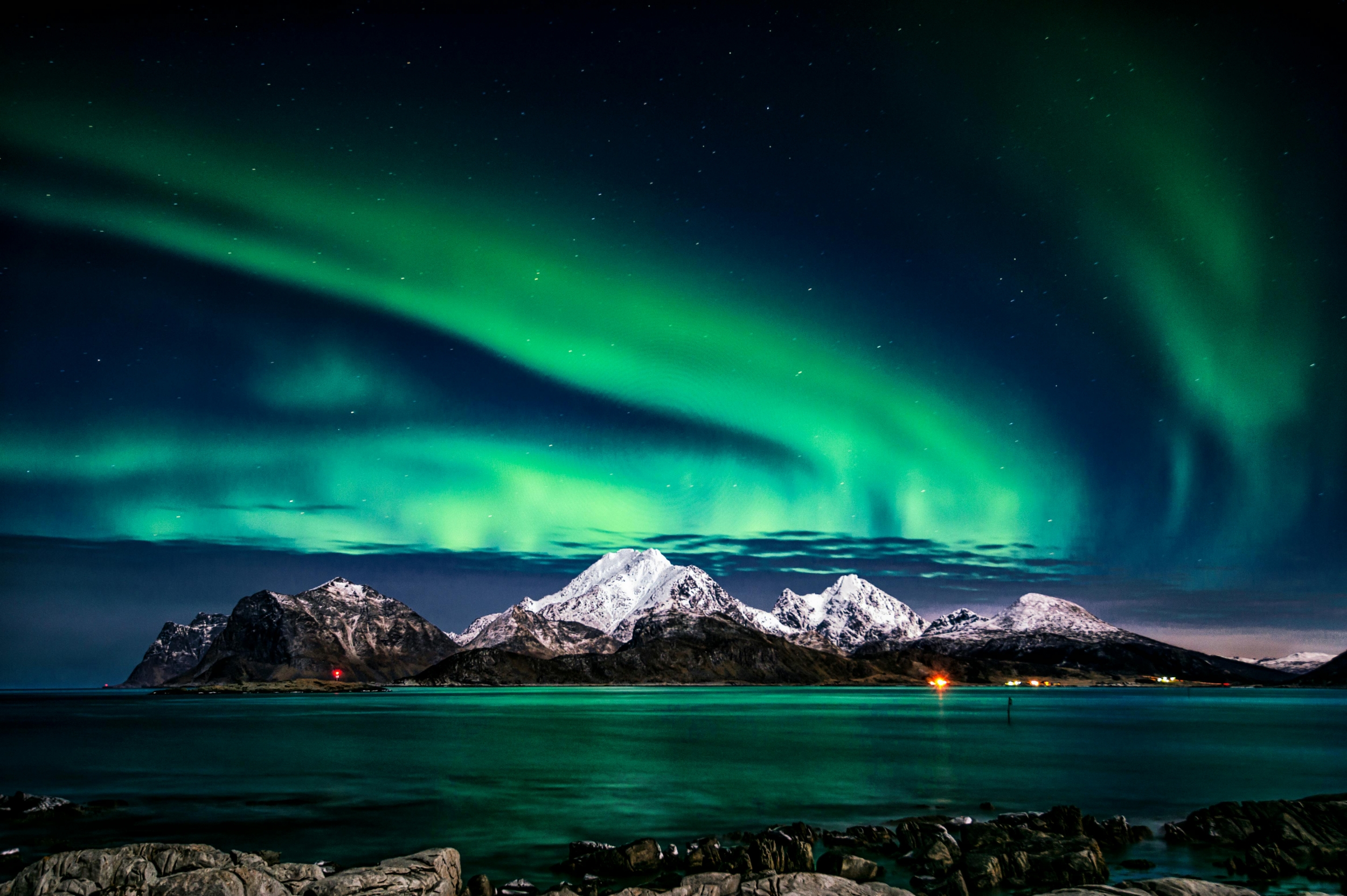 Vibrant Aurora Borealis Over Snowcapped Mountains Starry Night Sky With Lake And Water