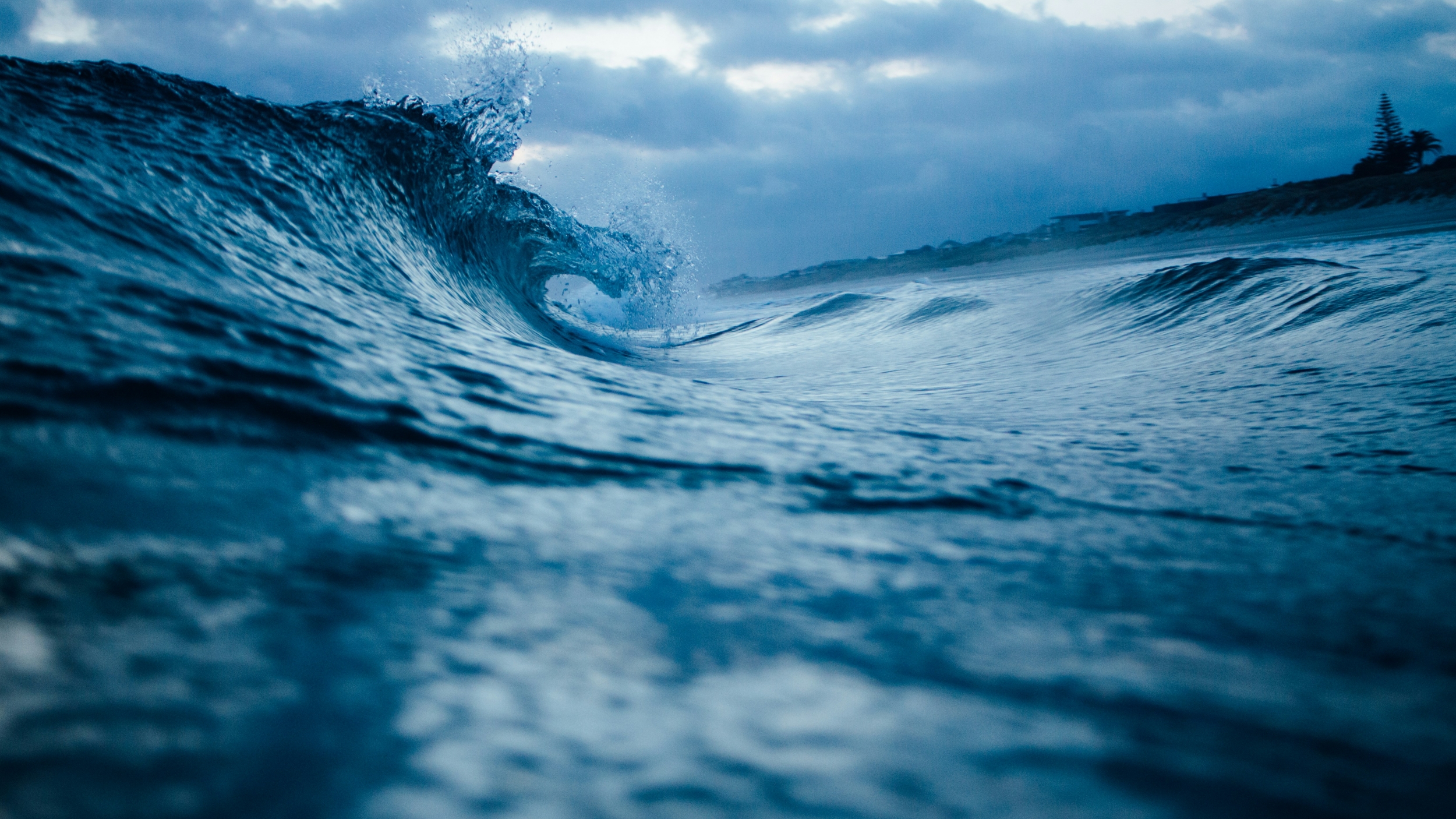 Waves Crashing On The Beach Gloomy Weather