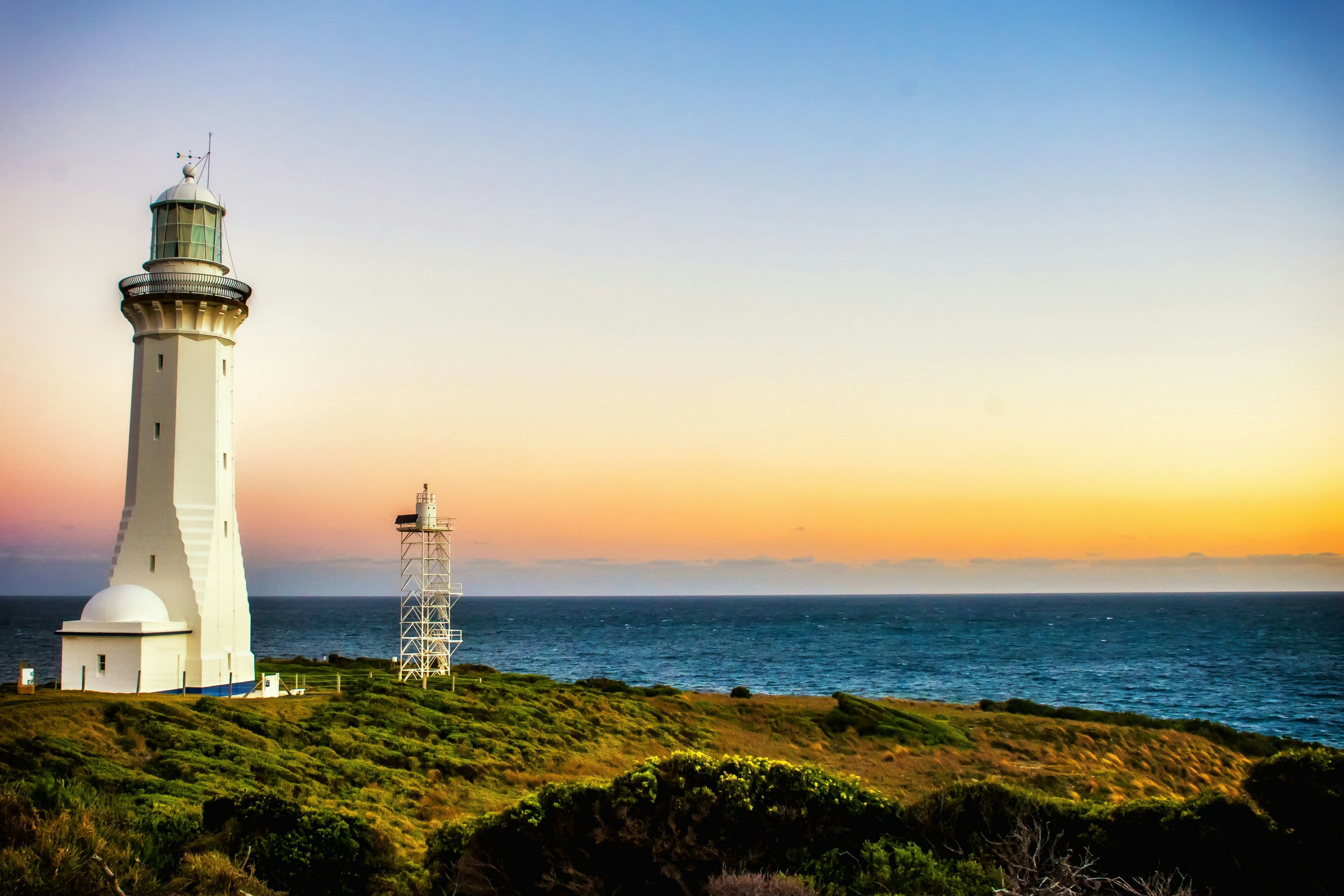 White Lighthouse At Sunset Ocean View wallpaper for Apple iPhone, Apple Watch, Mac, iPad and Apple Watch